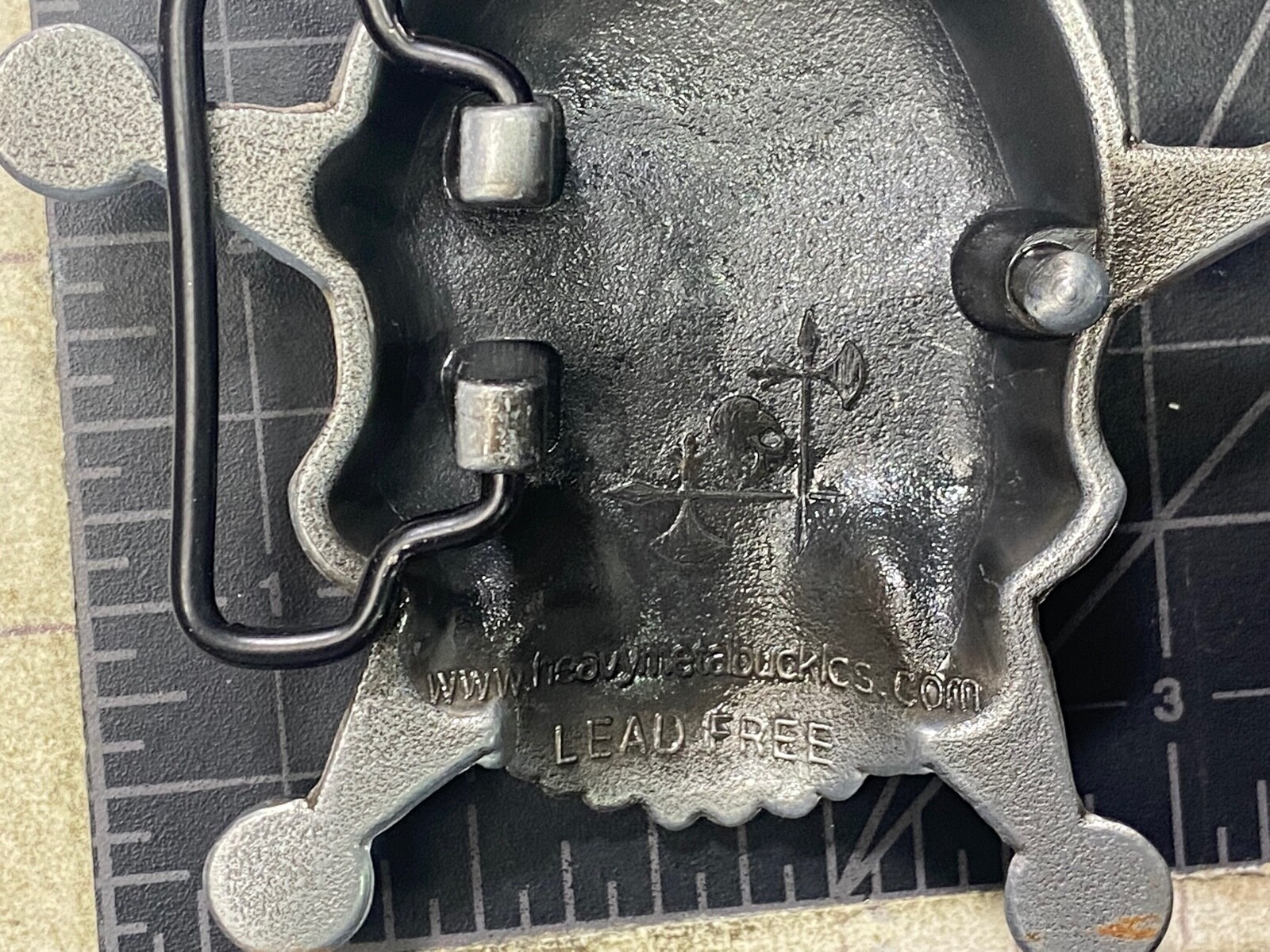Skull with evil grin! in five point badge style star w/ Black Eyes belt buckle
