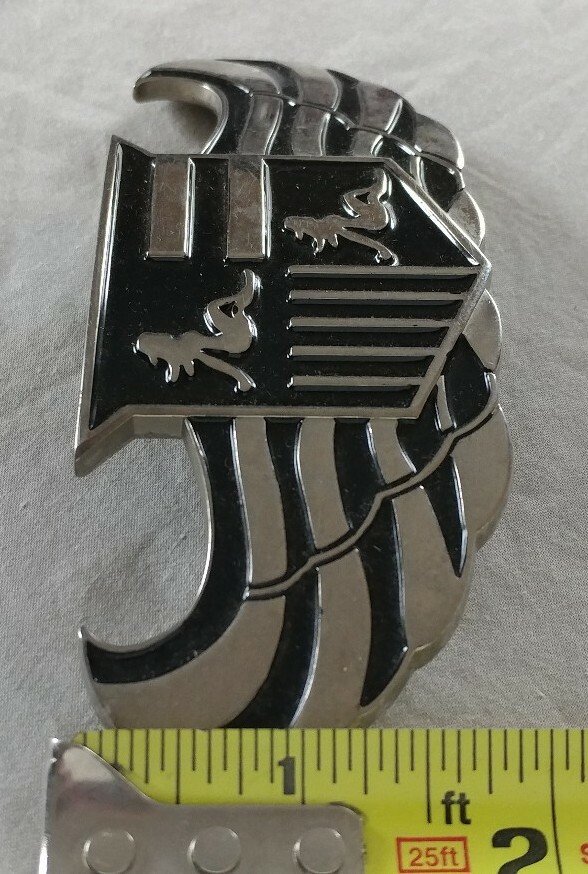 WINGS SHIELD MUD FLAP GIRL CREST BOTTLE OPENER BELT BUCKLE PRONG NEEDS REPAIR