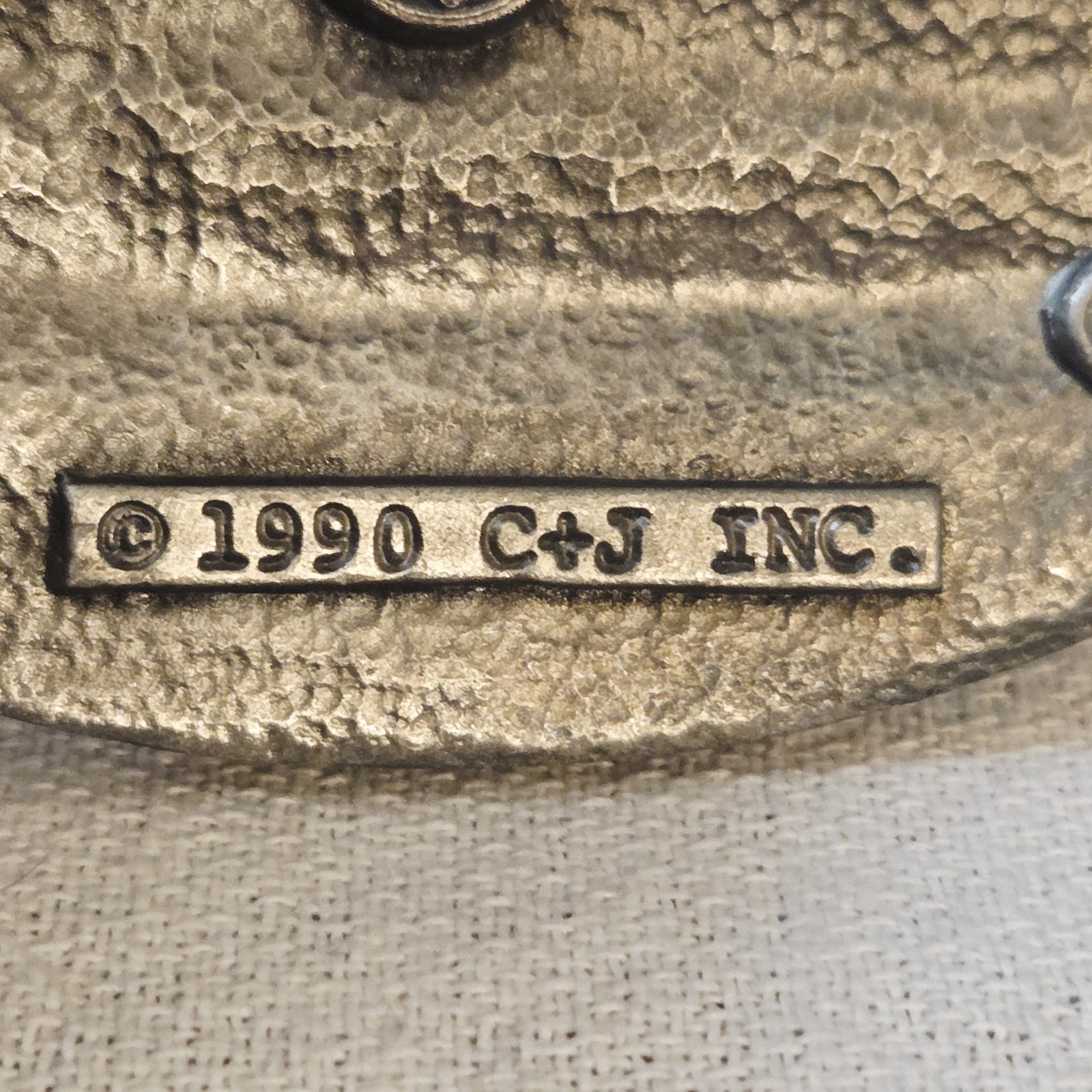 Belt Buckle – C+J Inc. 1990 Snowmobiler (with wear)