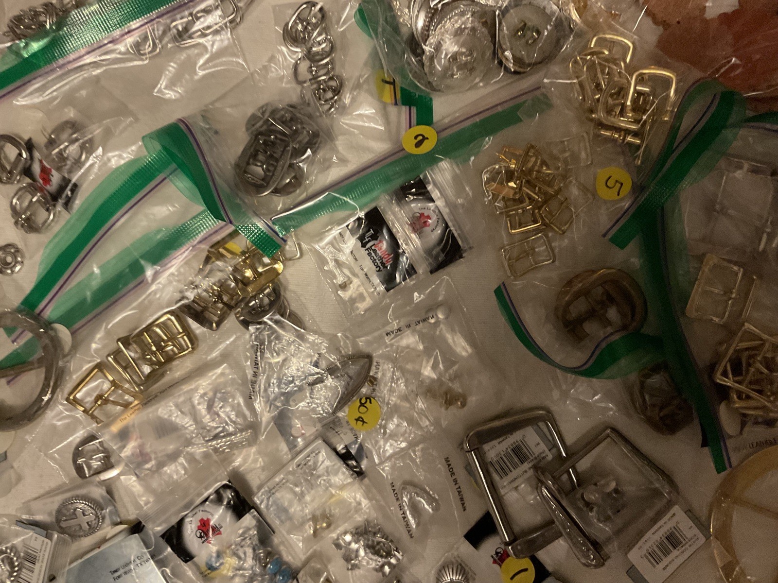 LOT OF 200 ITEMS: BUCKLES/ADDITIONAL ITEMS- VARIOUS STYLES AND DESIGNS – BOX 1