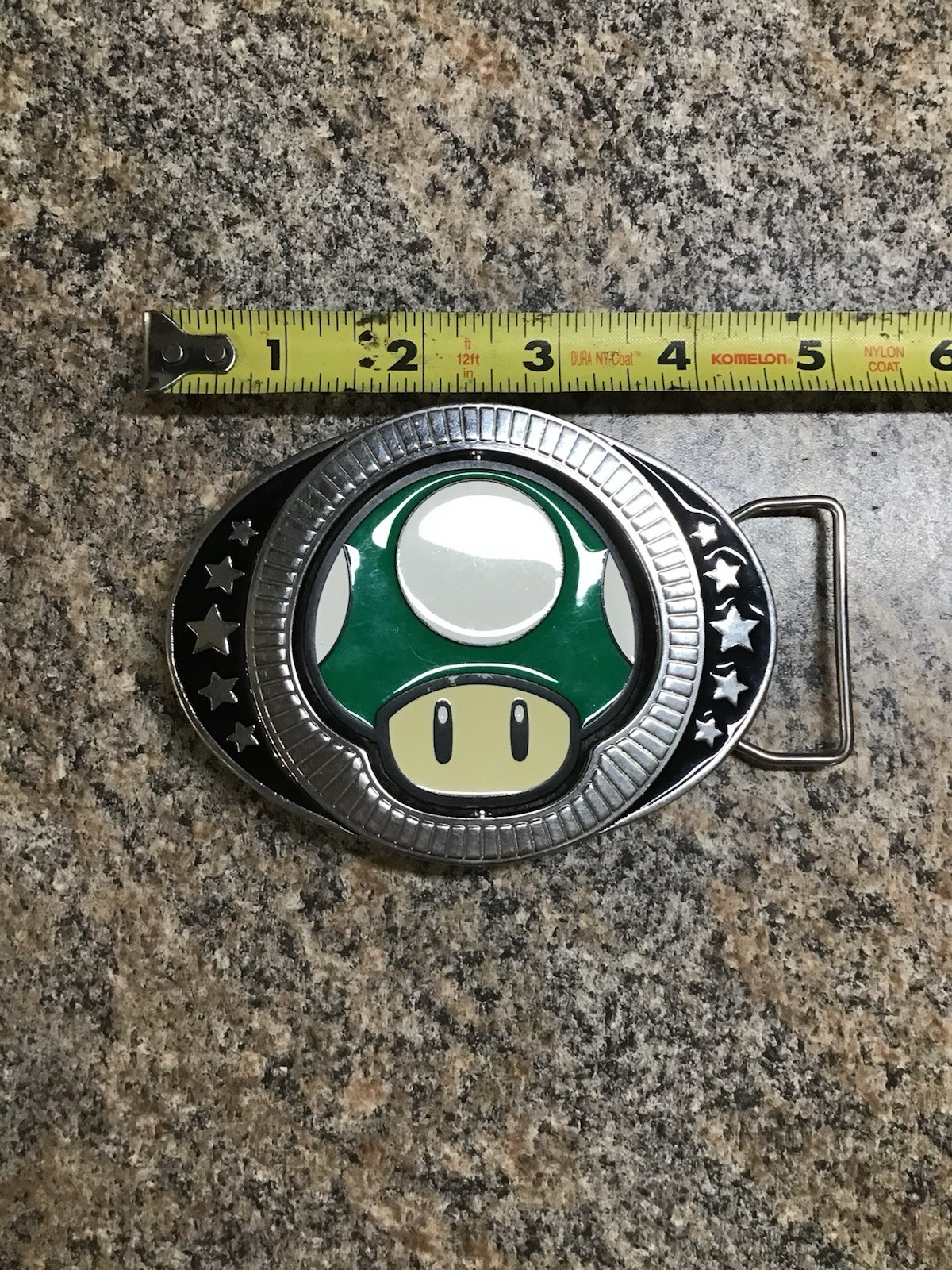 2011 Nintendo Super Mario Brothers reversible red green mushroom belt buckle