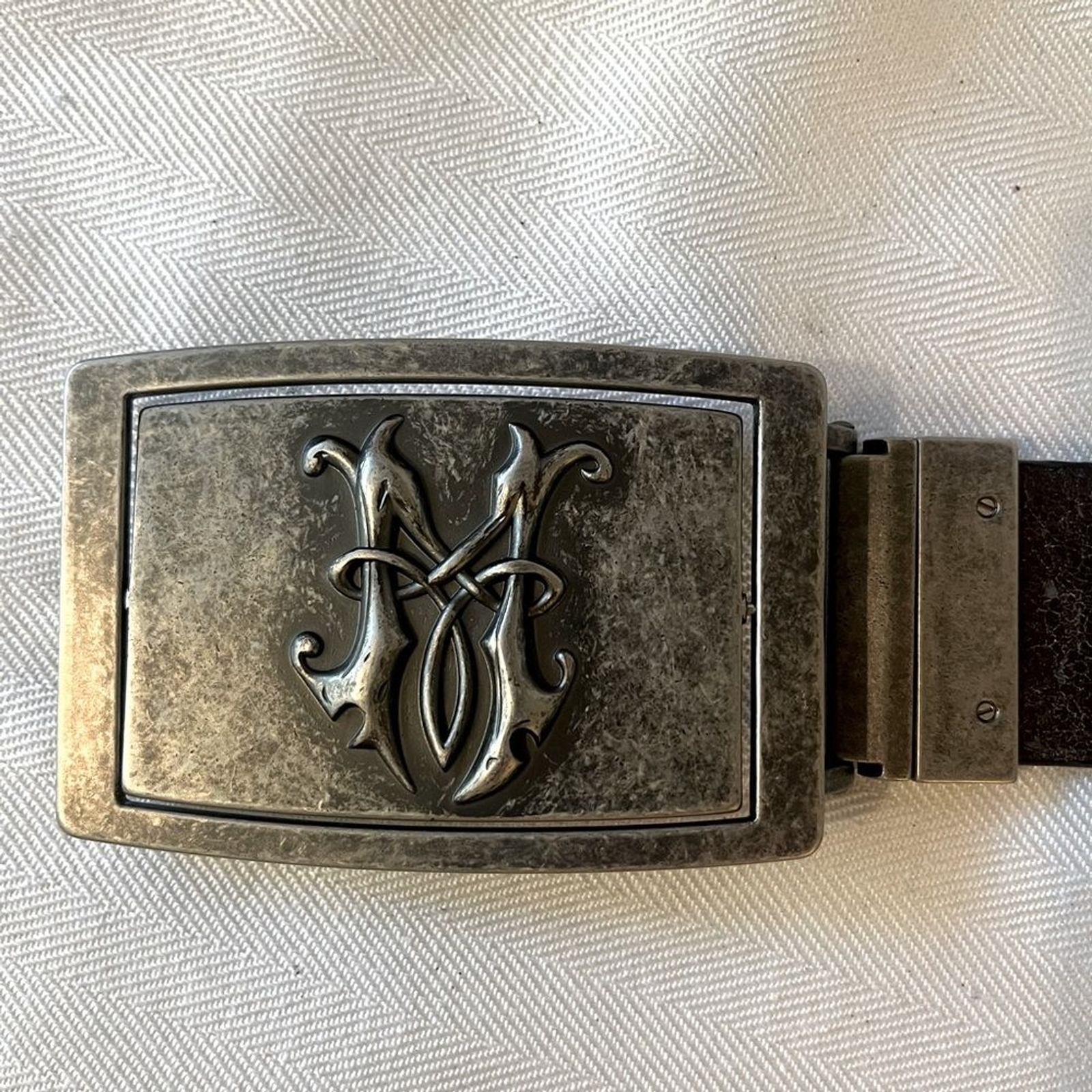 Fleur de Lis reversible pewter type belt buckle. Monogram M on the reverse side