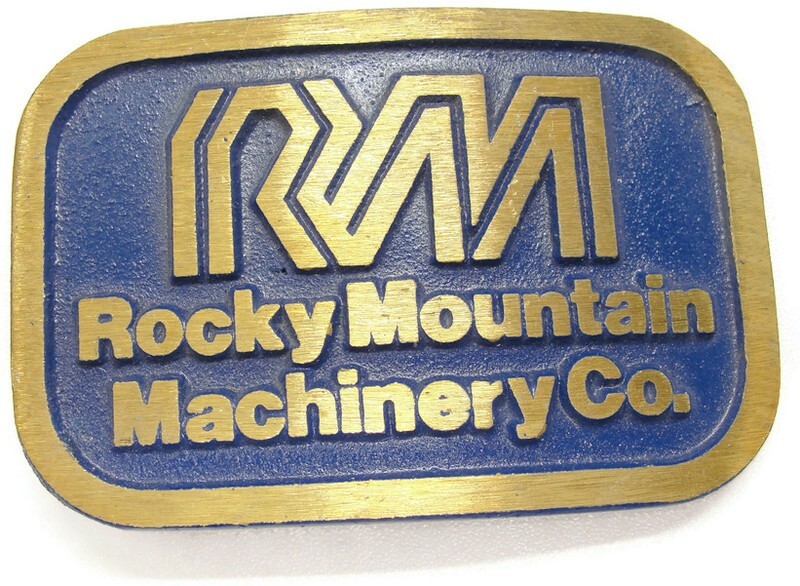 RM Rocky Mountain Machinery Co Blue & Gold Tone Belt Buckle Dynabuckle Utah