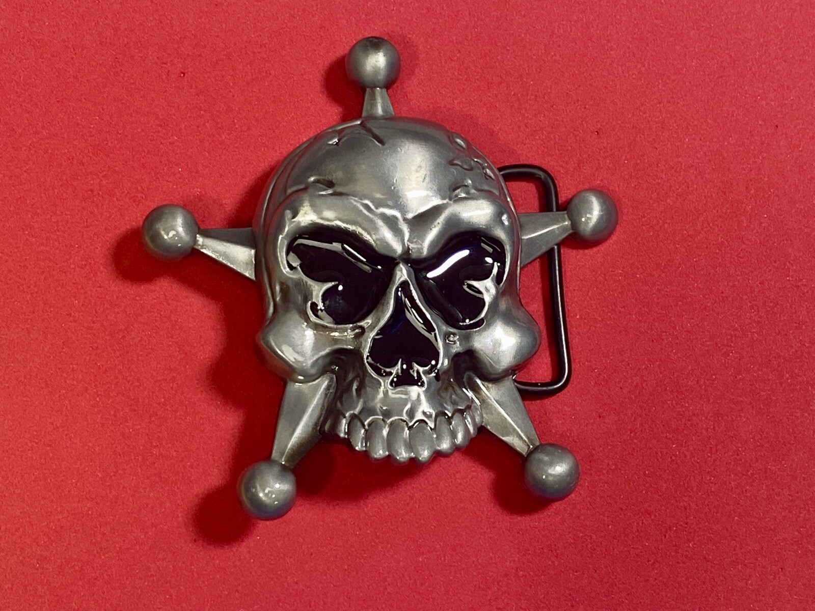 Skull with evil grin! in five point badge style star w/ Black Eyes belt buckle