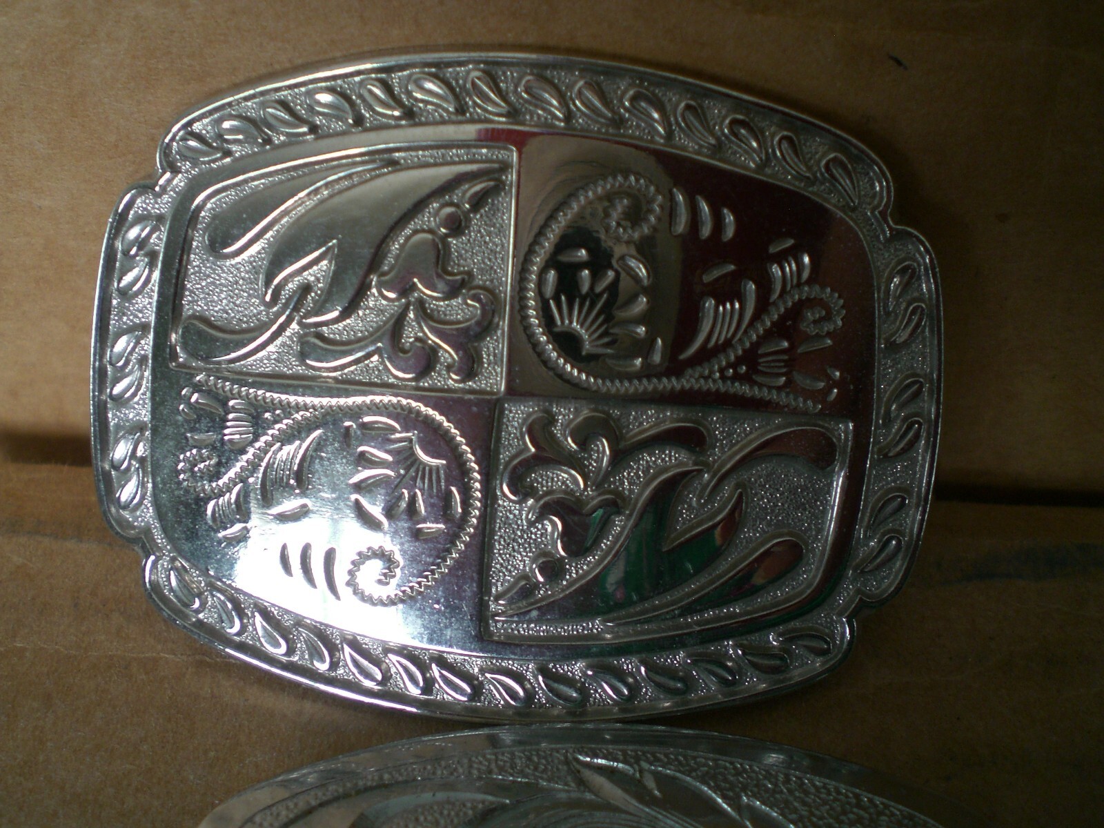 2 silver tone shiny belt buckles