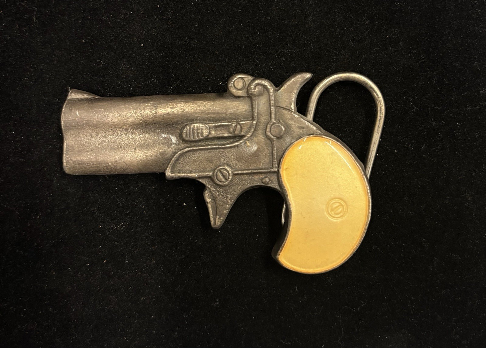 Vintage Bergamot Brass Works derringer belt buckle, featuring a gun-shaped RARE