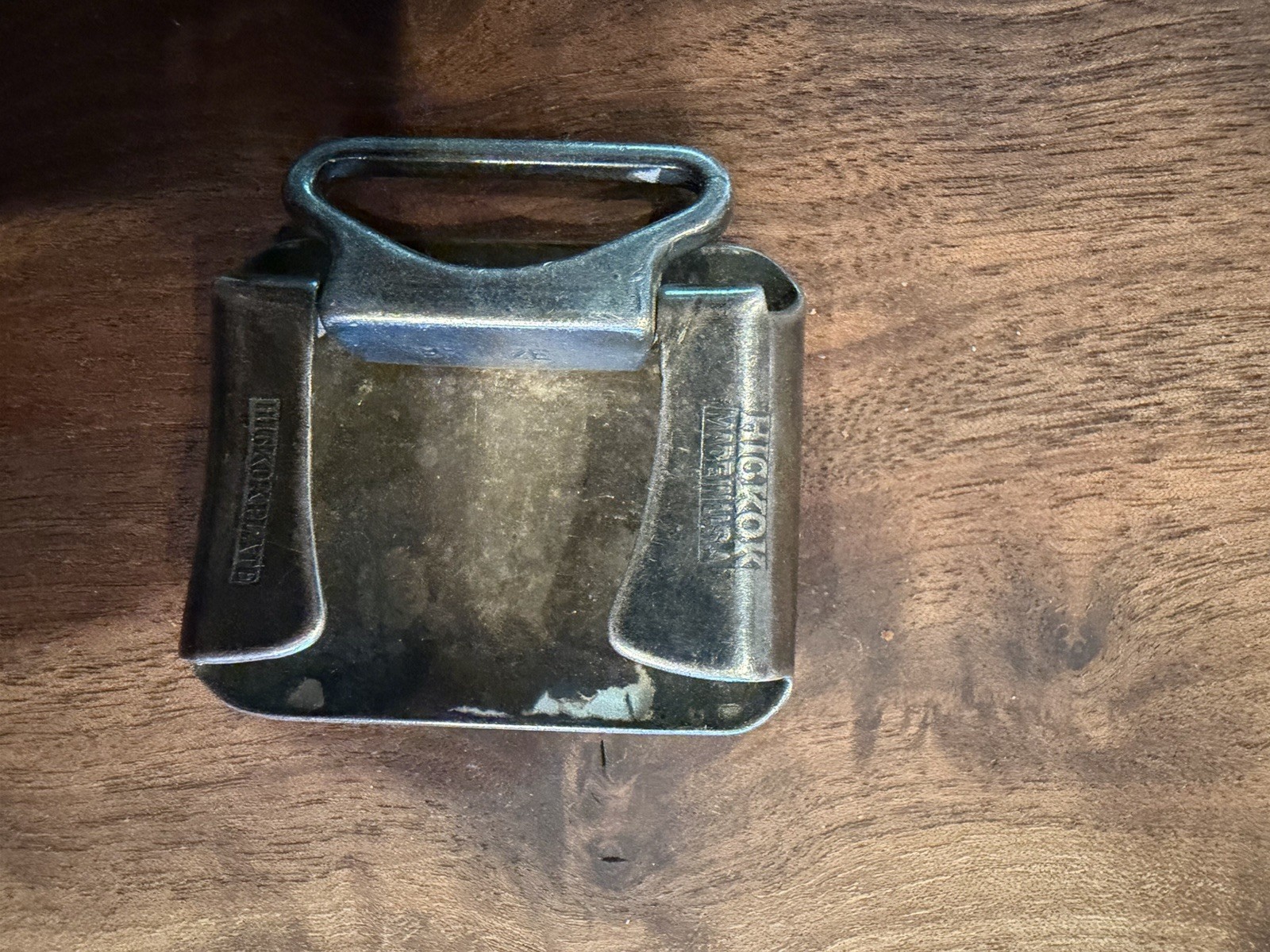 This belt buckle features an engraved image of the Billiken. Hickok Plate