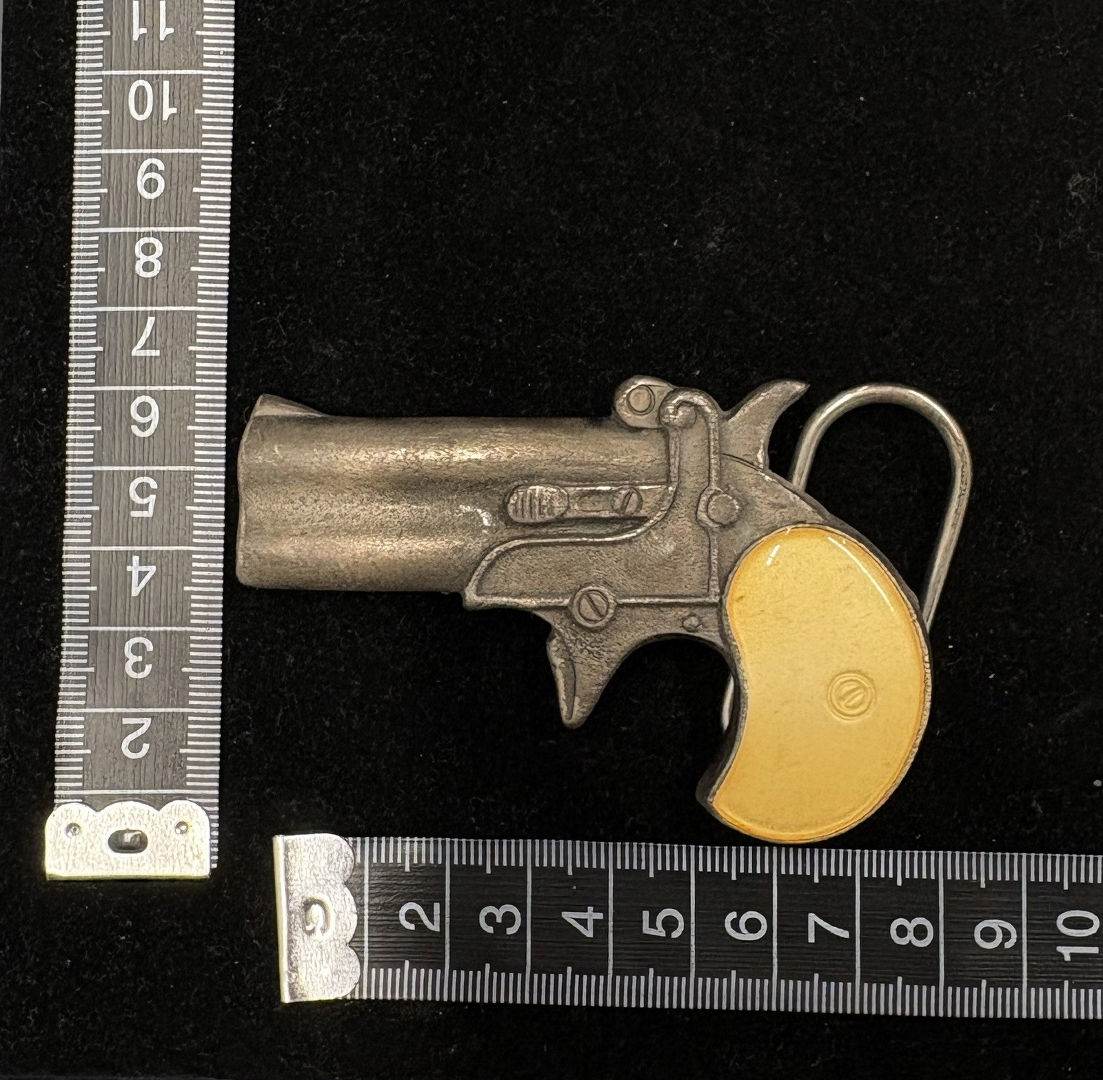 Vintage Bergamot Brass Works derringer belt buckle, featuring a gun-shaped RARE