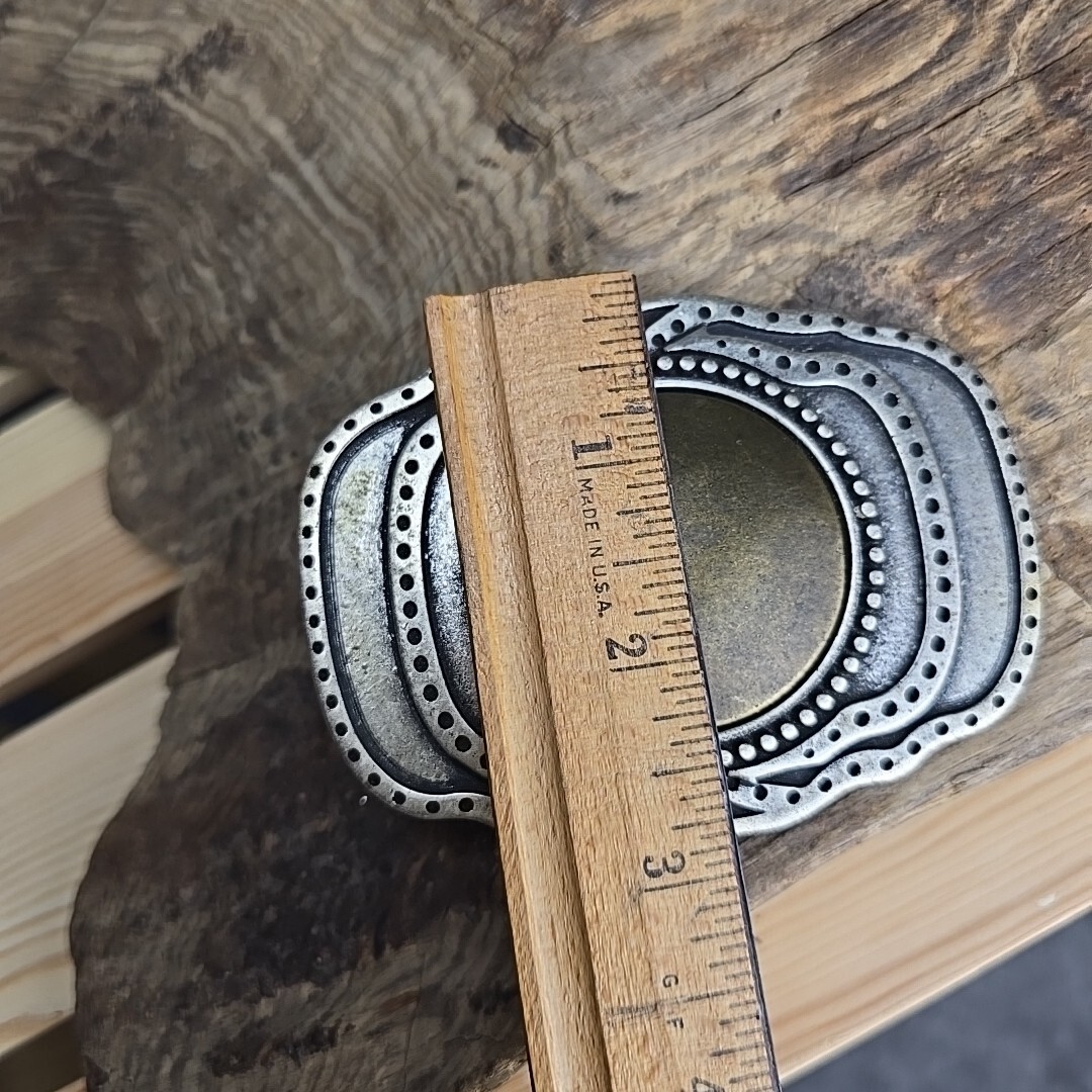Unique vintage brass and steel belt buckle.