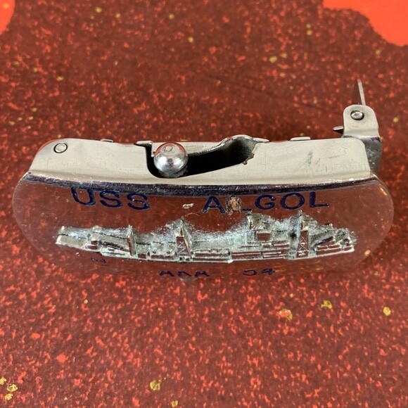U.S. Navy belt buckle. “U.S.S. Algol AKA-54. Raised ship graphic.