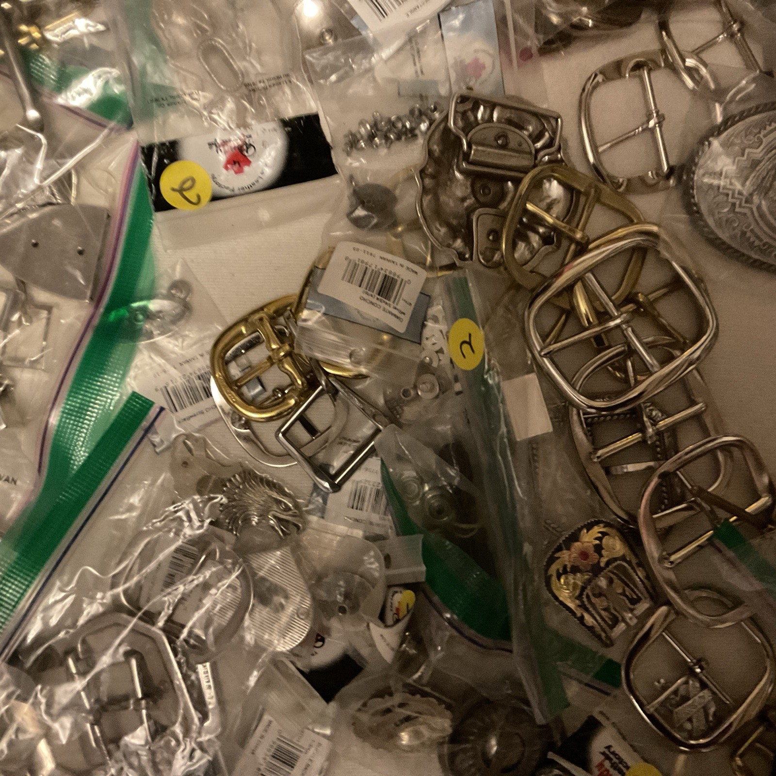 LOT OF 200 ITEMS: BUCKLES/ADDITIONAL ITEMS- VARIOUS STYLES AND DESIGNS – BOX 2