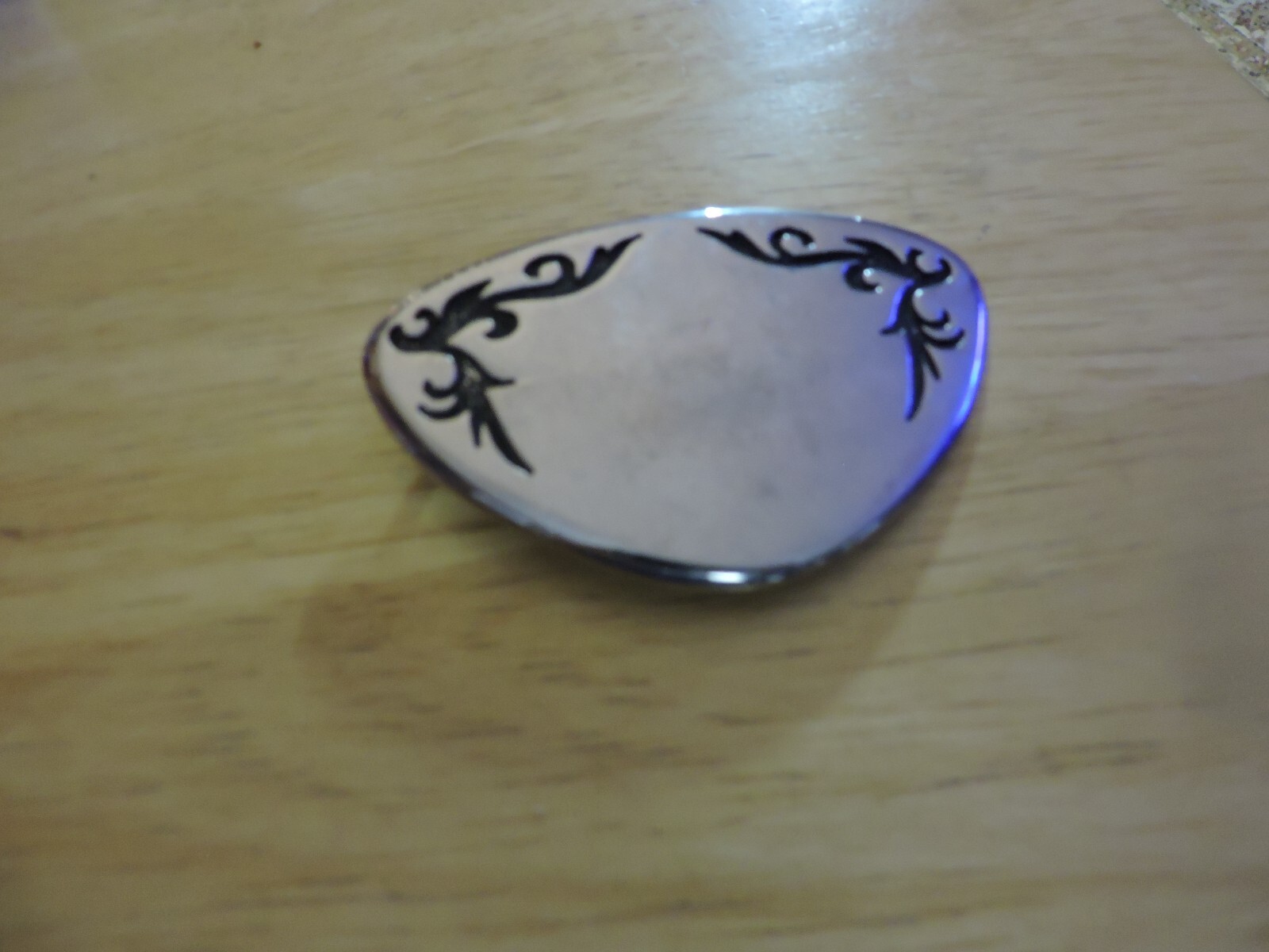BELT BUCKLE SILVER WITH BLACK DESIGN TRIANGULAR SHAPE 3X2 INCHES