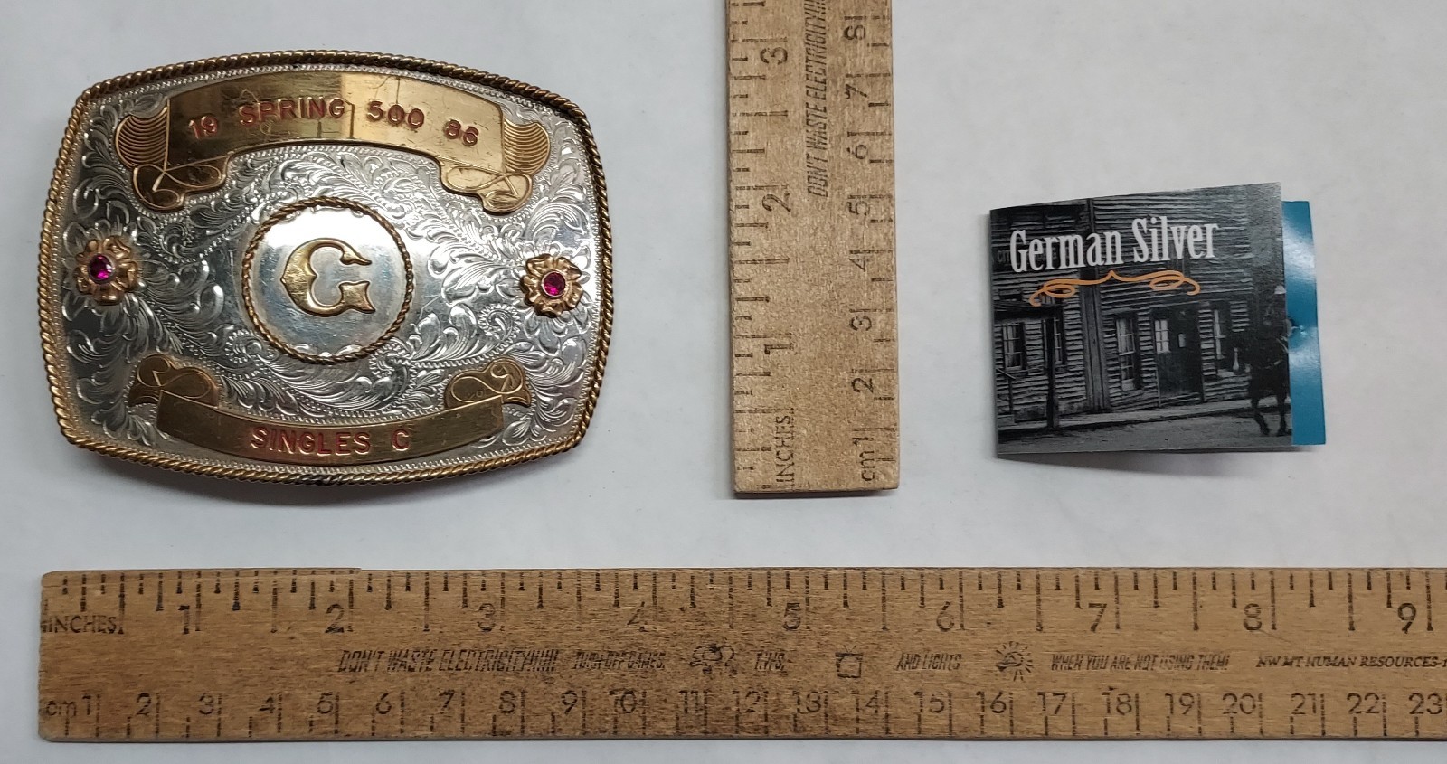 1986 – SPRING 500 – SINGLES C – GERMAN SILVER – BELT BUCKLE – listing # 9560