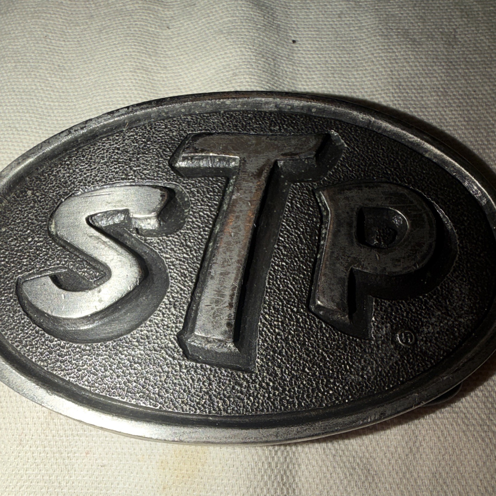 Vintage STP Corporation Advertising Belt Buckle Silver Tone Auto Racing Promo