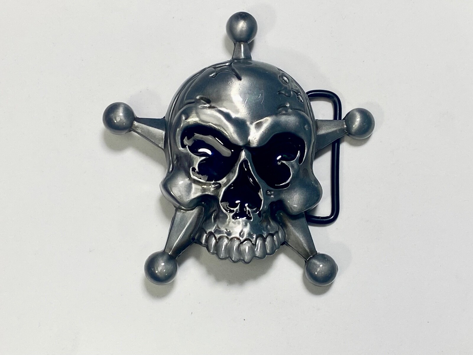 Skull with evil grin! in five point badge style star w/ Black Eyes belt buckle
