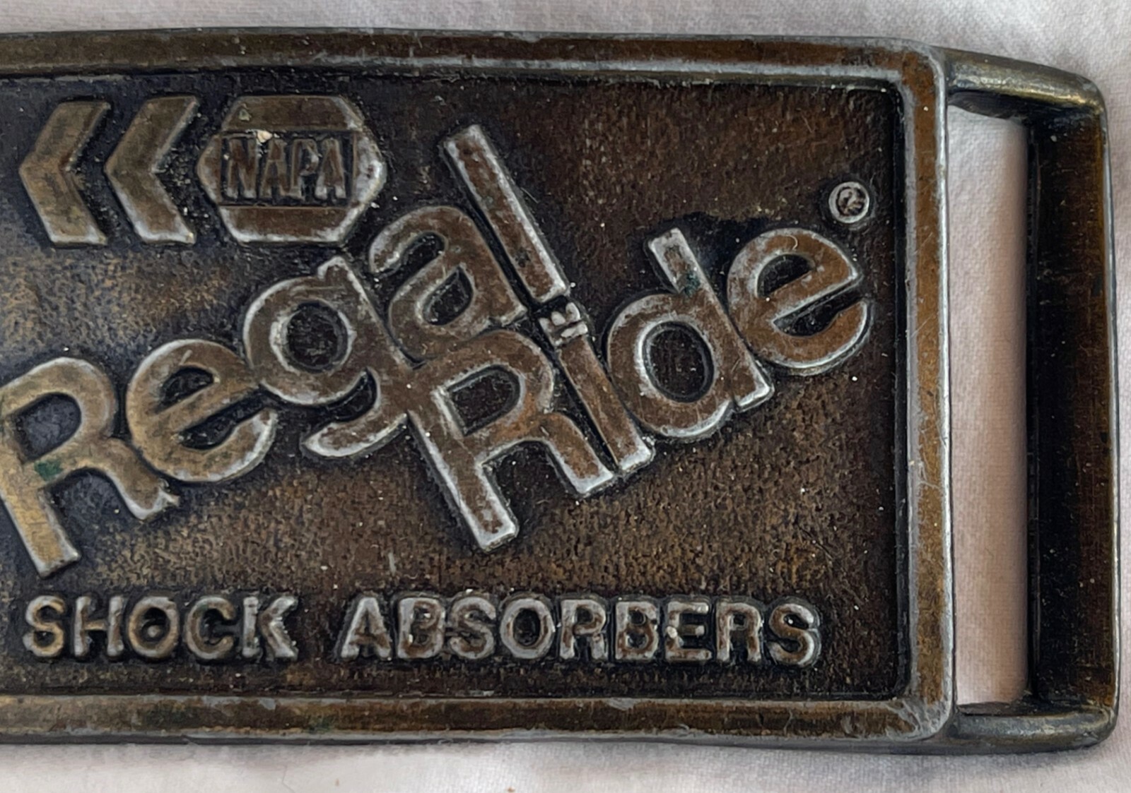 NAPA REGAL RIDE SHOCK ABSORBERS HEAVY METAL BELT BUCKLE, Stamped P-119 EUC