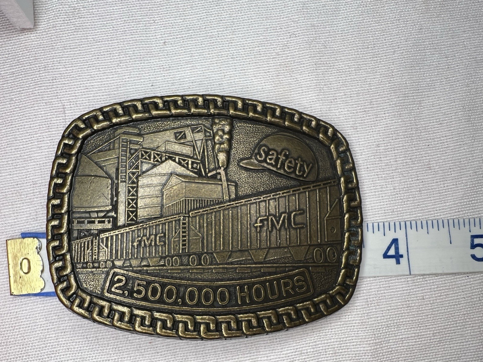FMC Safety Award Belt Buckle – 2,500,000 Hours – Brass Industrial Factory Scene