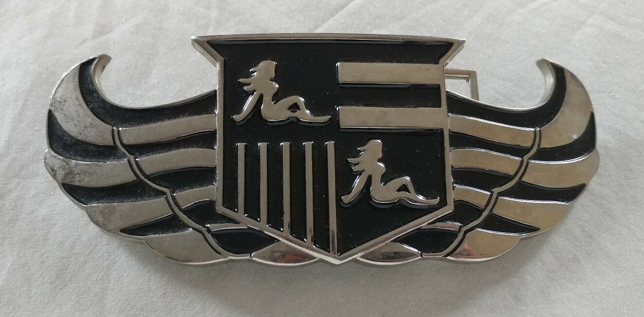 WINGS SHIELD MUD FLAP GIRL CREST BOTTLE OPENER BELT BUCKLE PRONG NEEDS REPAIR
