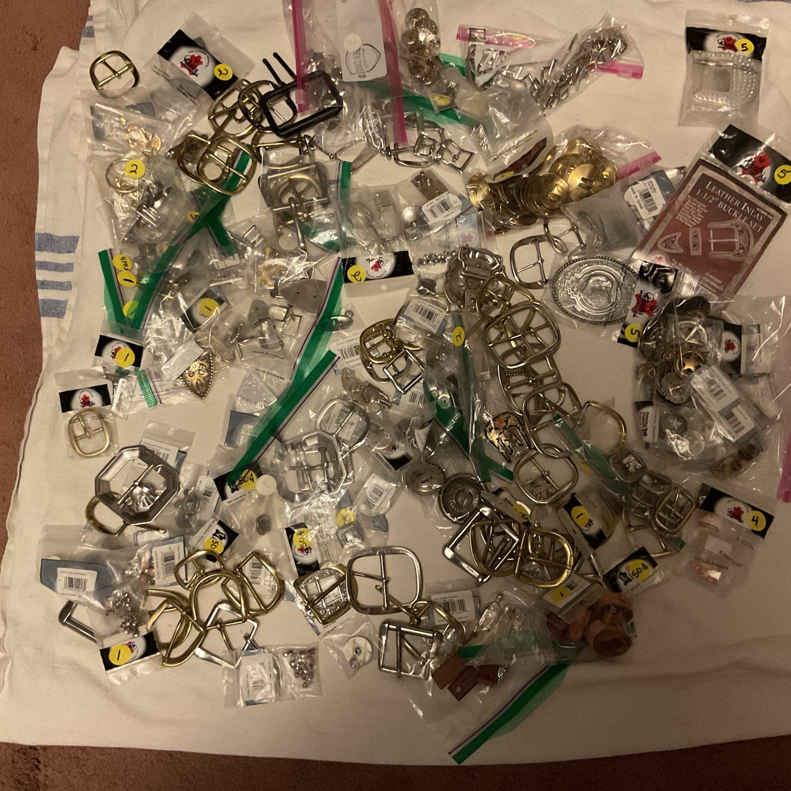 LOT OF 200 ITEMS: BUCKLES/ADDITIONAL ITEMS- VARIOUS STYLES AND DESIGNS – BOX 2