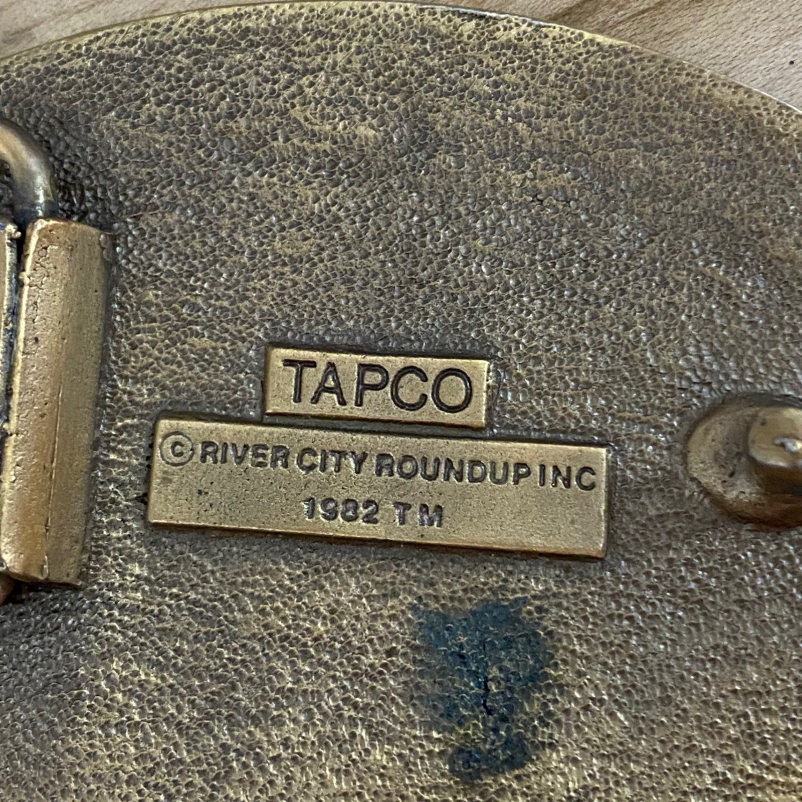 Vintage 1982 River City Roundup Belt Buckle Tapco Gold Tone Black Enamel Rodeo
