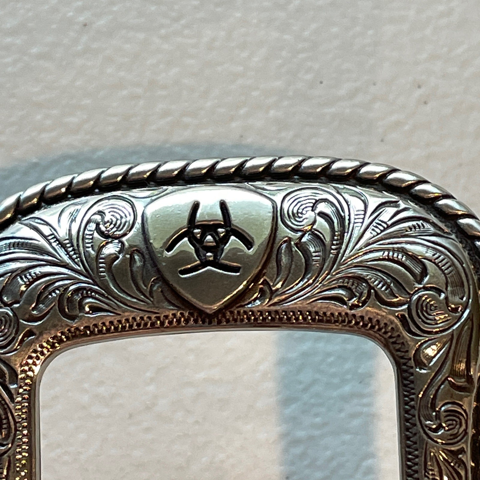 Ariat Western Belt Buckle Filigree Scroll Logo Silver Toned Rope Edge A2108