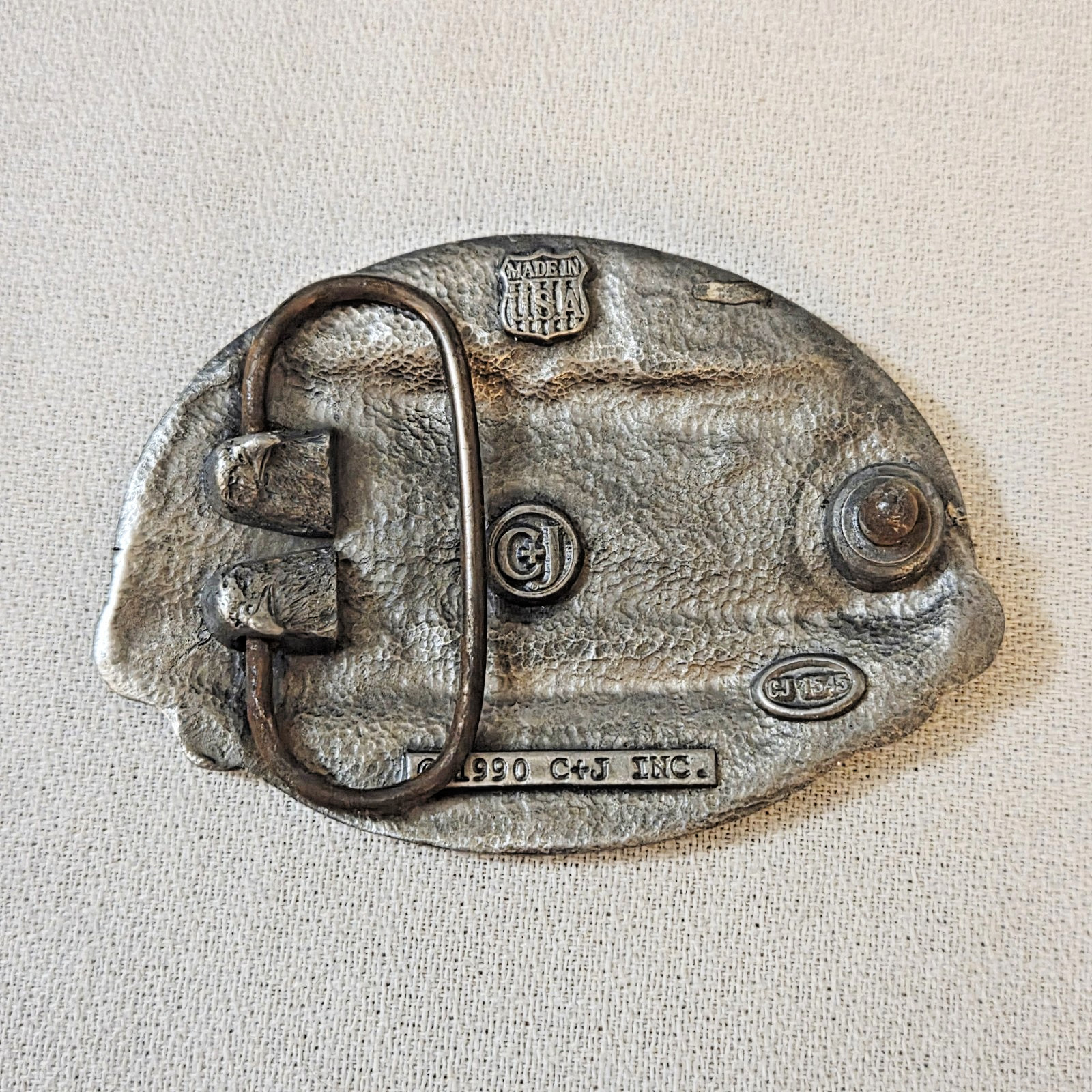 Belt Buckle – C+J Inc. 1990 Snowmobiler (with wear)