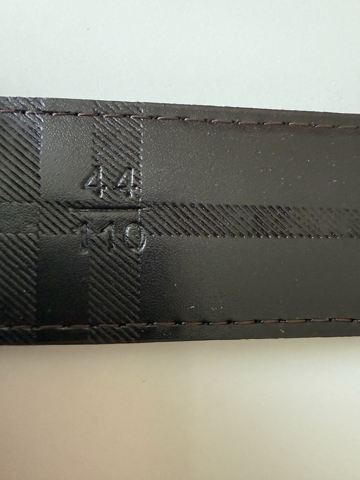 Burberry reversible belt in sand tone. polished metal buckle of the Equestrian
