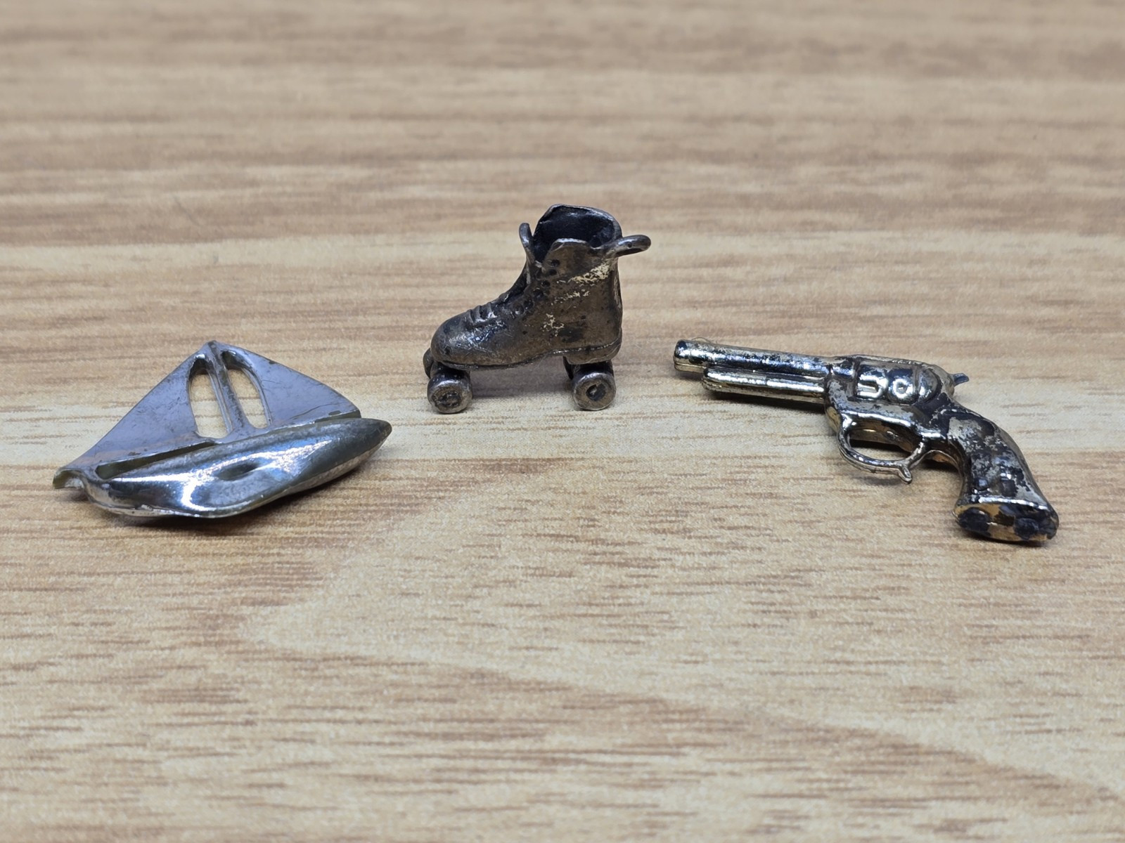 Vintage Miniature Roller Skate Shoe Revolver and Sailing Boat Trinkets