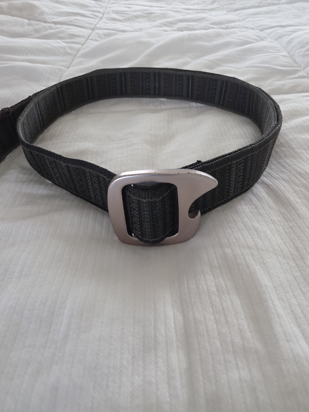 Bison Designs Tap Cap 38 mm belt featuring a gunmetal-colored bottle opener