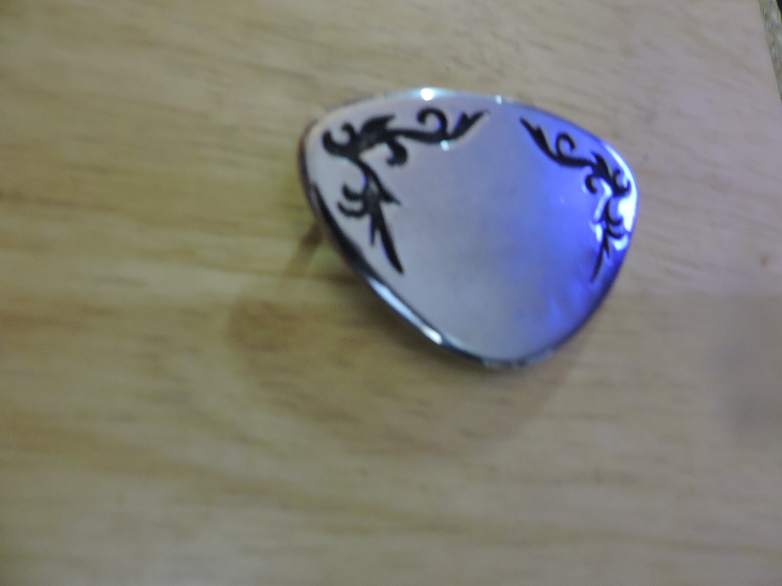 BELT BUCKLE SILVER WITH BLACK DESIGN TRIANGULAR SHAPE 3X2 INCHES