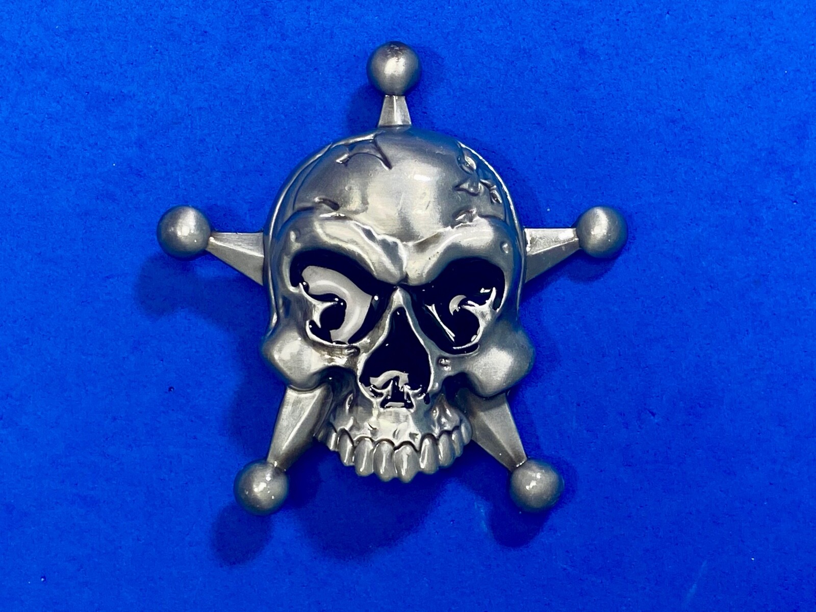 Skull with evil grin! in five point badge style star w/ Black Eyes belt buckle