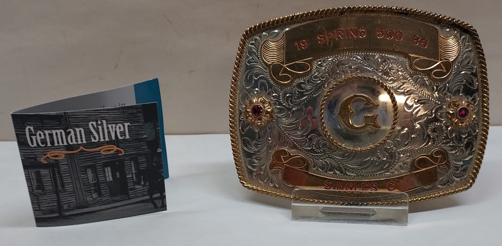 1986 – SPRING 500 – SINGLES C – GERMAN SILVER – BELT BUCKLE – listing # 9560
