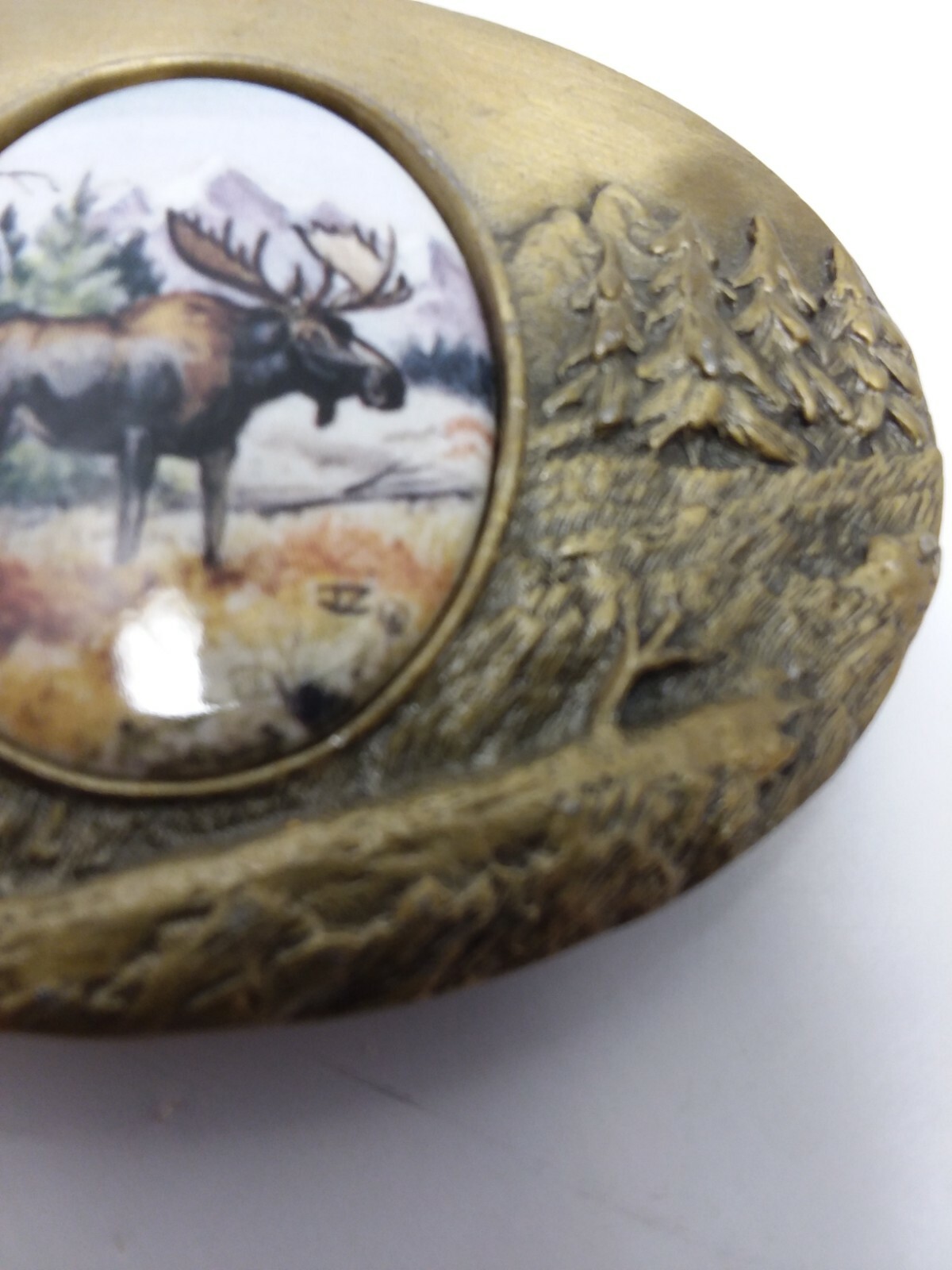 Artistic impression MOOSE belt buckle designed by Julie Zsupnik, 2004