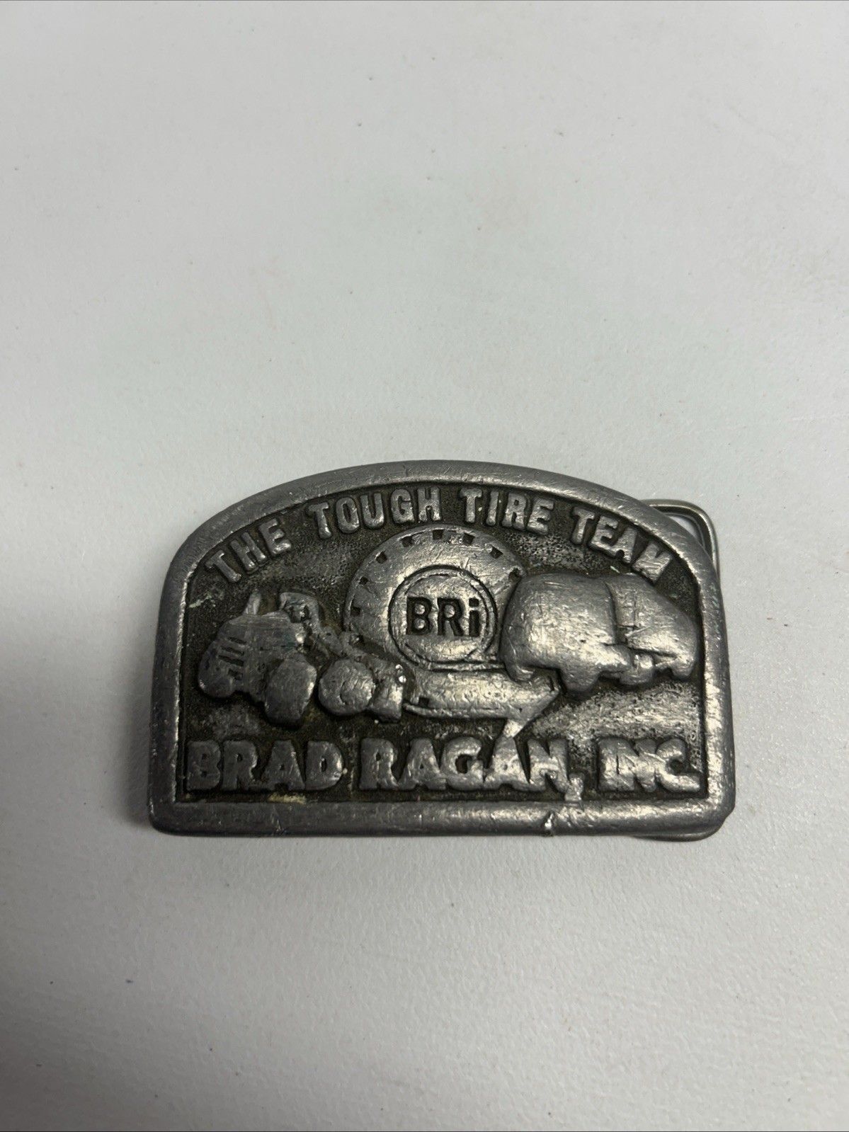 Vintage Brad Ragan Inc. The Tough Tire Team BRi Belt Buckle Metal Illinois