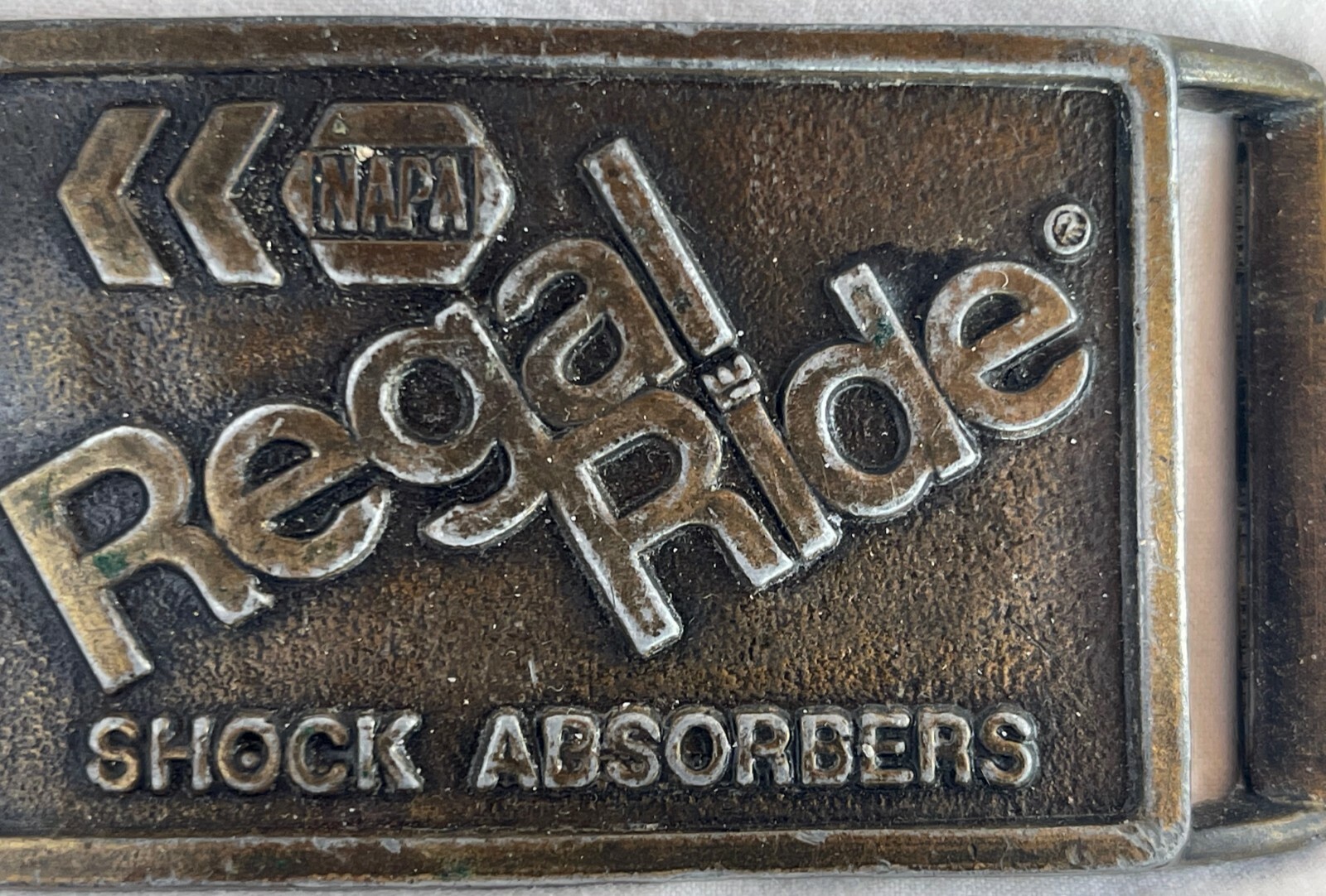 NAPA REGAL RIDE SHOCK ABSORBERS HEAVY METAL BELT BUCKLE, Stamped P-119 EUC