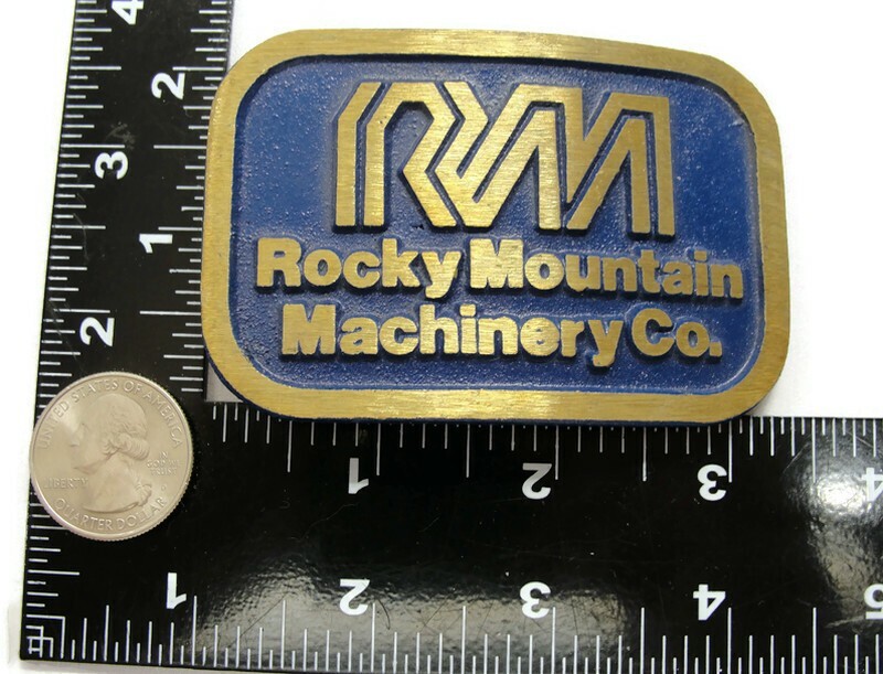 RM Rocky Mountain Machinery Co Blue & Gold Tone Belt Buckle Dynabuckle Utah