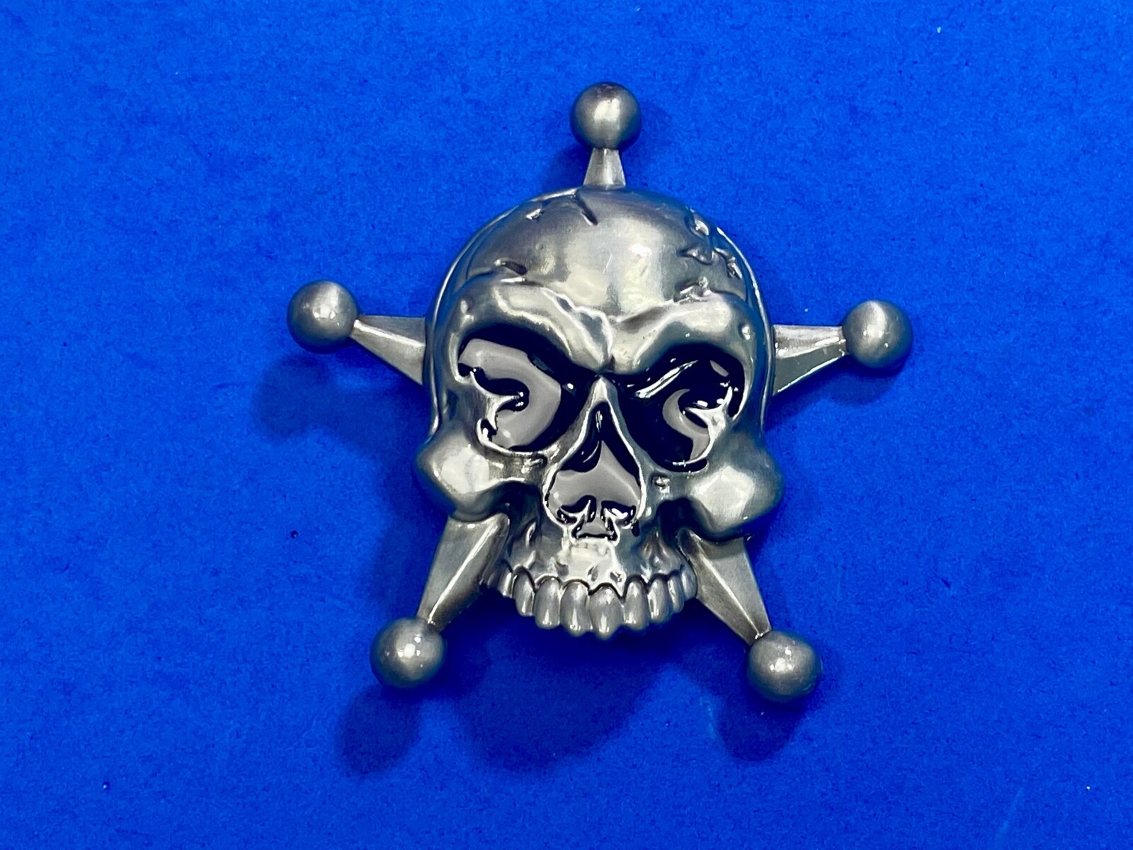 Skull with evil grin! in five point badge style star w/ Black Eyes belt buckle