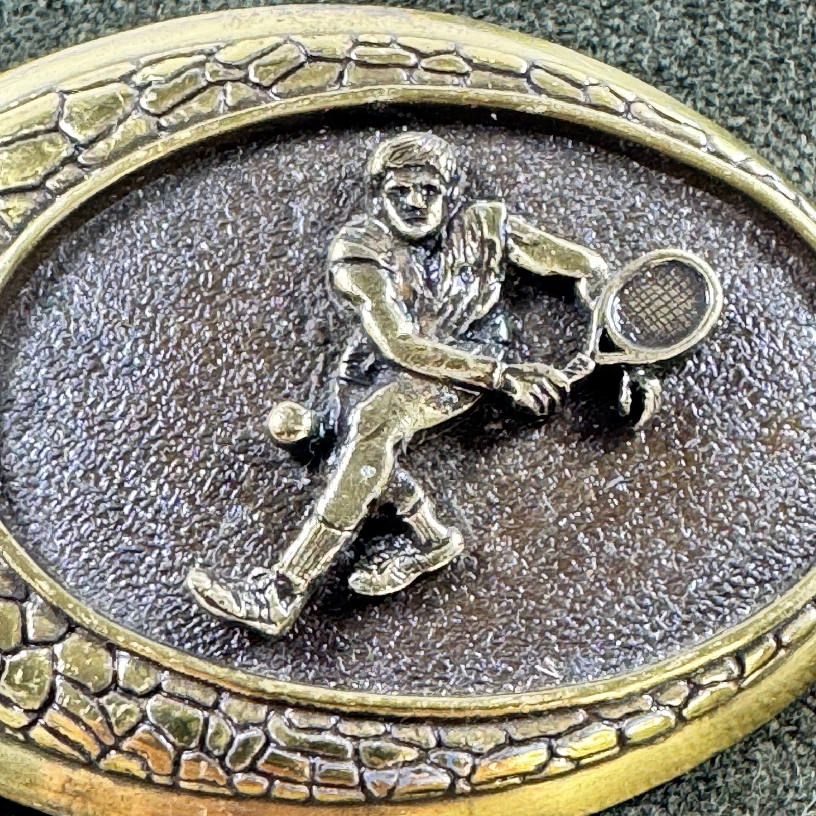 Vintage 1982 Raintree Tennis Player Belt Buckle Gold Bronze Tone Oval Sports