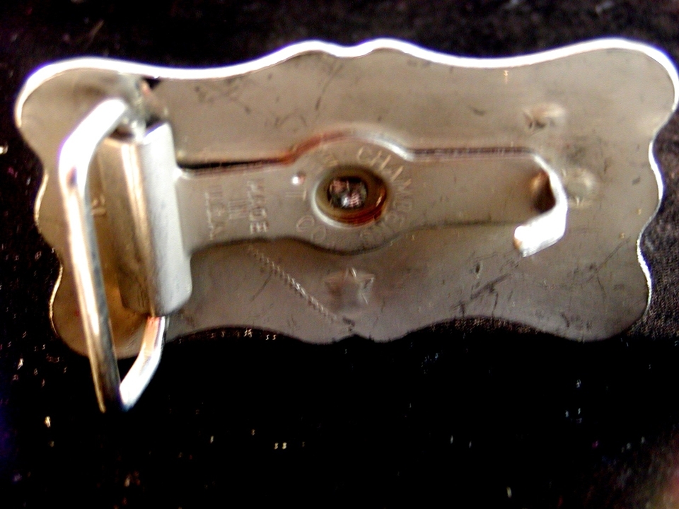 Bronco riding belt buckle with star design