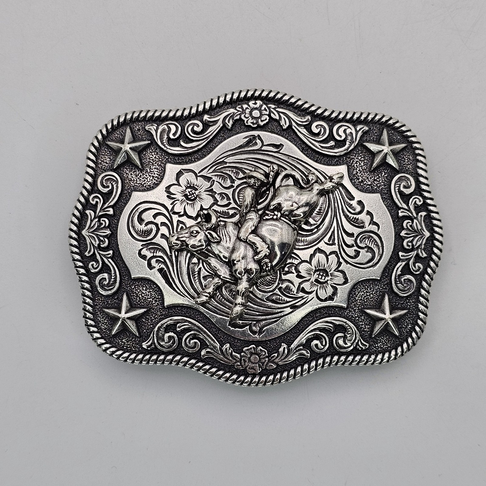 Nocona Western Belt Buckle Bull Rider Rope Edge Rectangular Silver Tone Stars