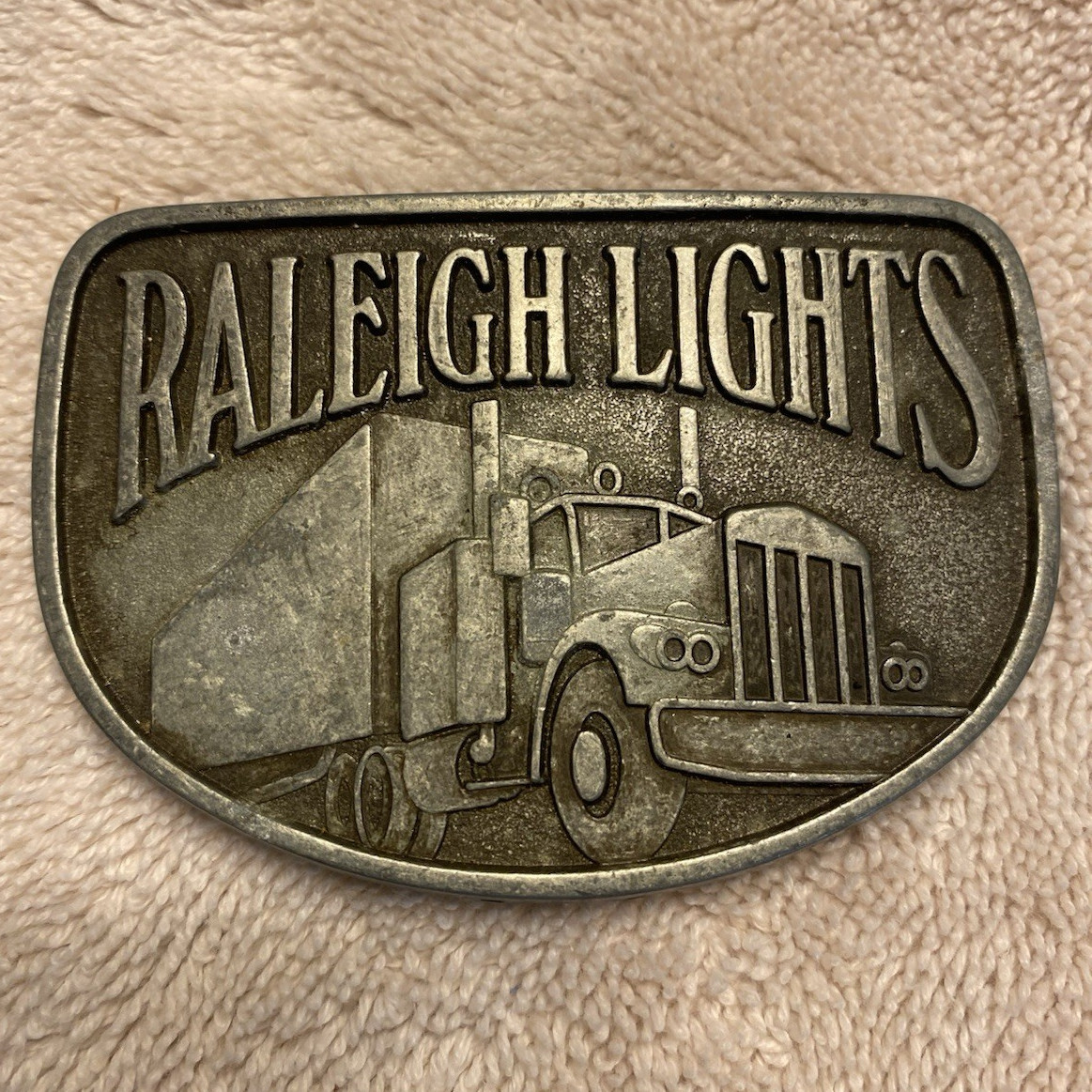 Raleigh Lights Silver Western Belt Buckle Rectangle Truck Graphic Logo