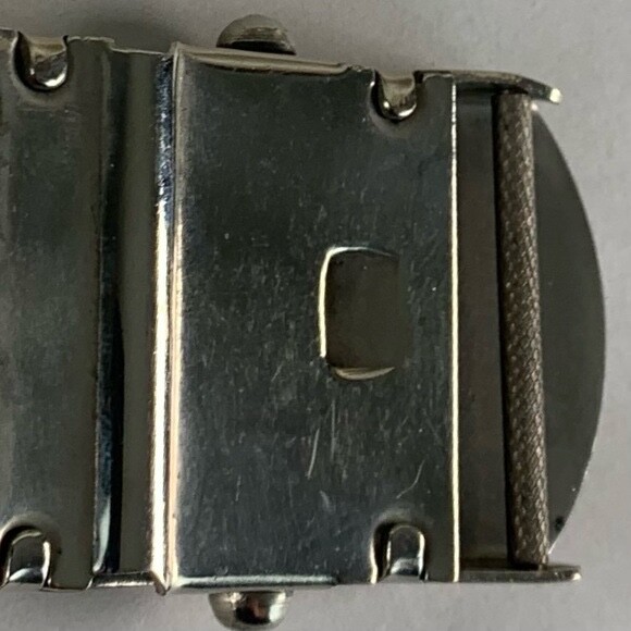 U.S. Navy belt buckle. “U.S.S. Algol AKA-54. Raised ship graphic.