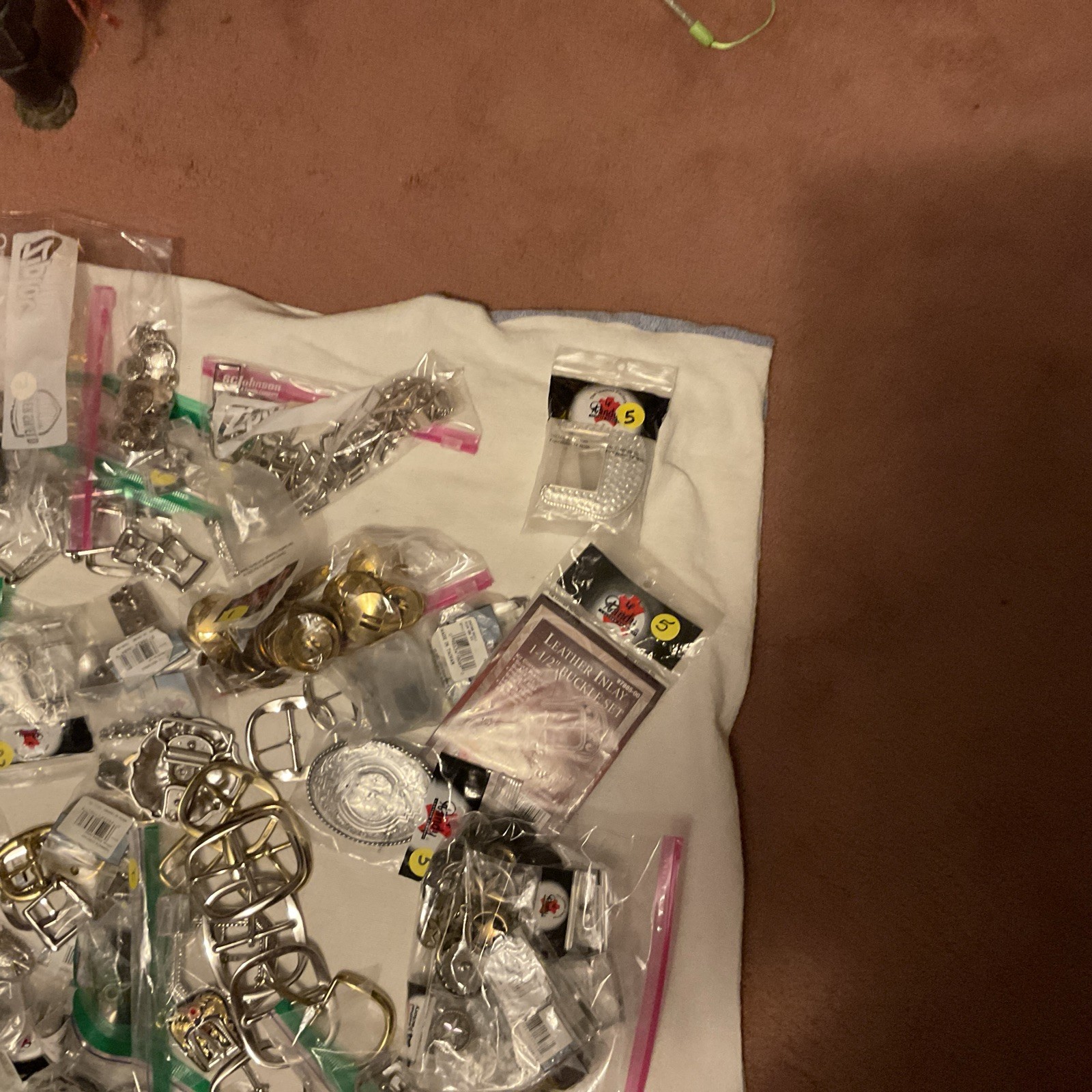LOT OF 200 ITEMS: BUCKLES/ADDITIONAL ITEMS- VARIOUS STYLES AND DESIGNS – BOX 2