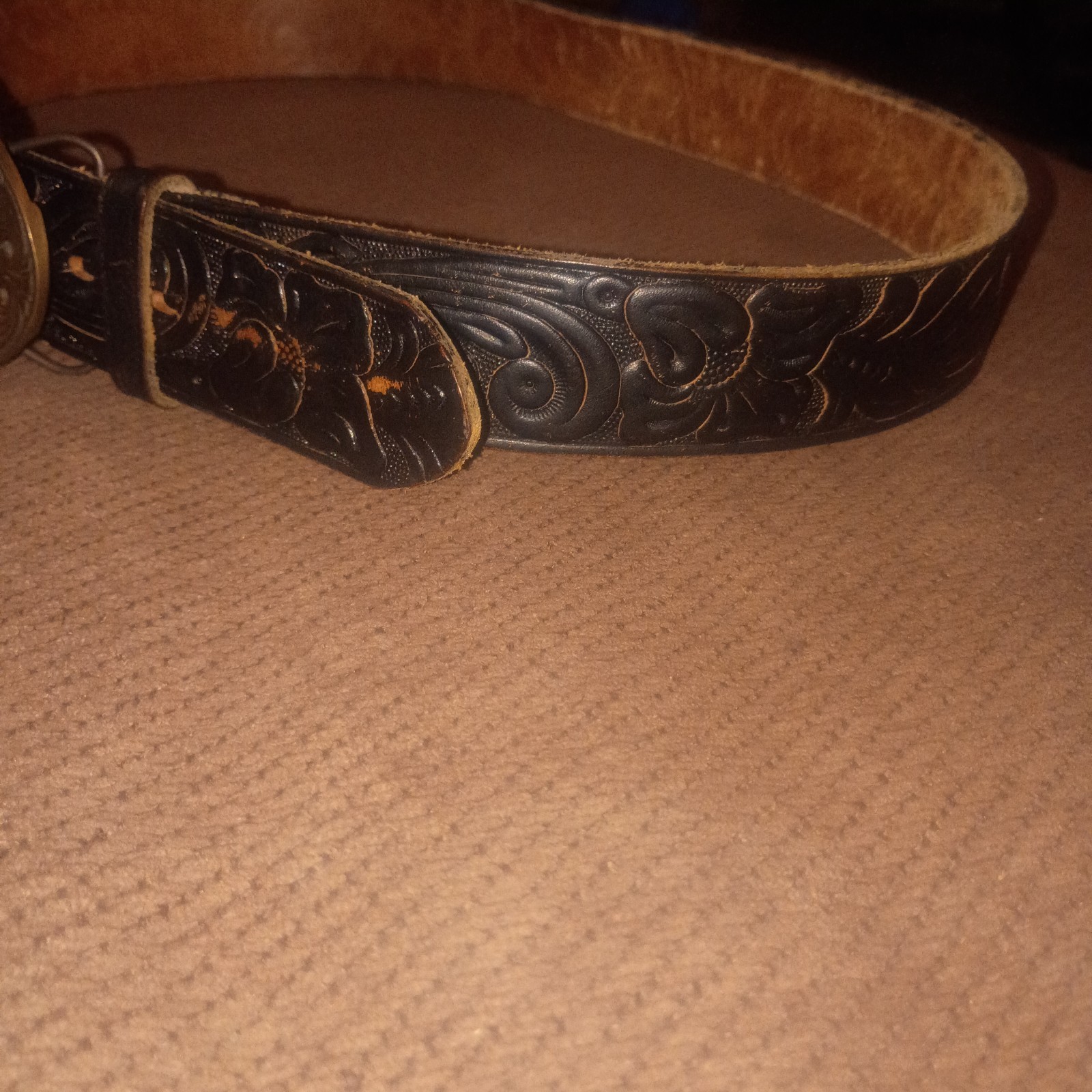 Vintage Montana Centennial Belt Buckle on antique black leather belt with design