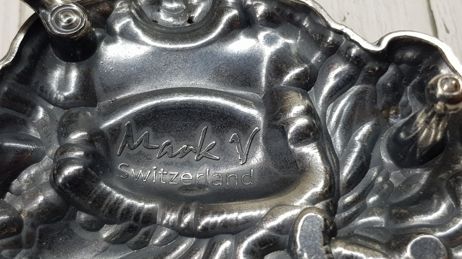 Belt Buckle Buddha, Switzerland, marking