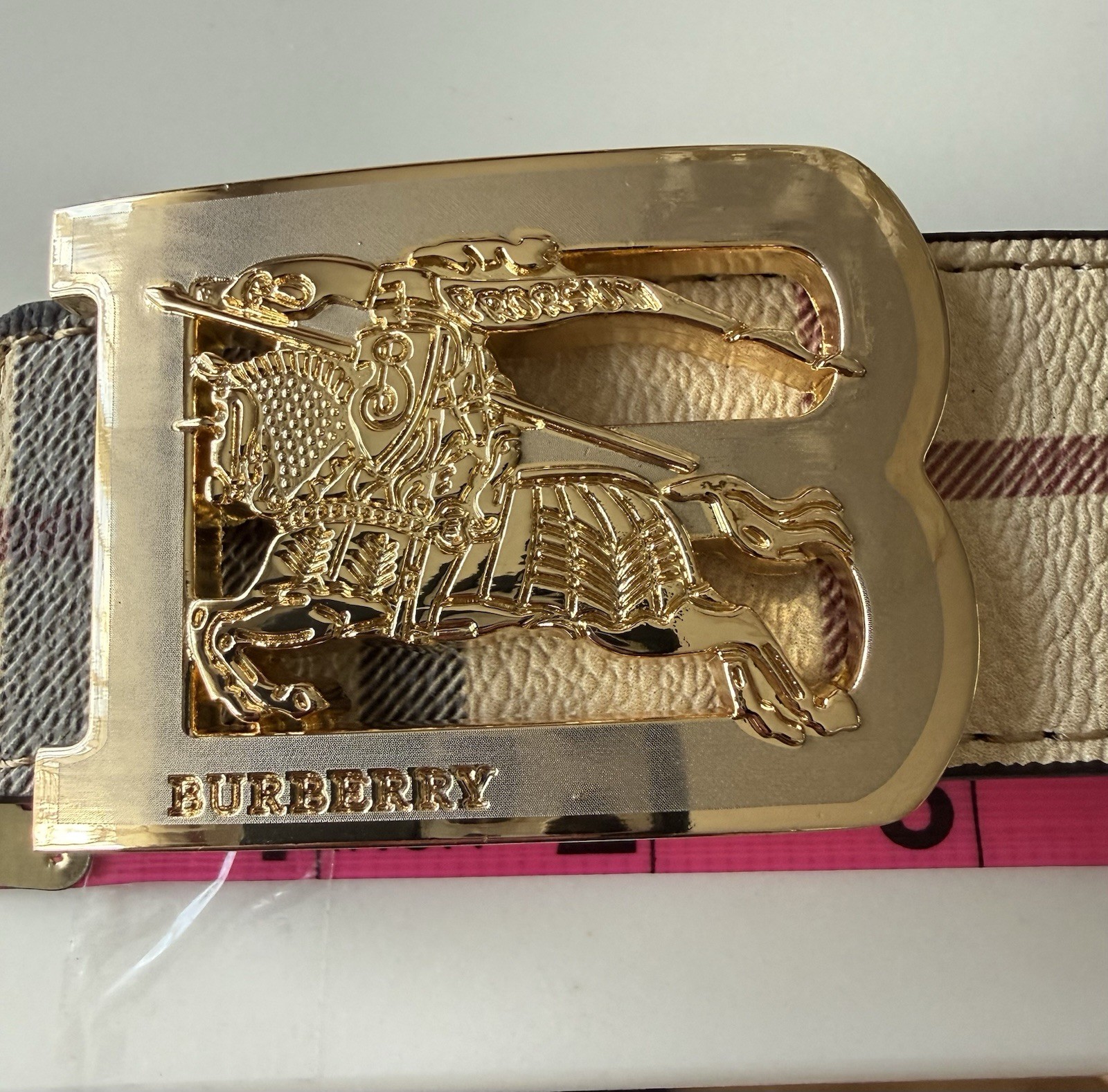 Burberry reversible belt in sand tone. polished metal buckle of the Equestrian