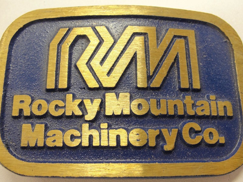 RM Rocky Mountain Machinery Co Blue & Gold Tone Belt Buckle Dynabuckle Utah