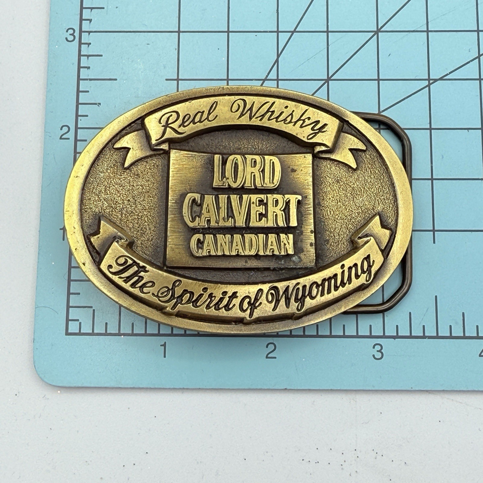 Vtg CLC Lord Calvert Canadian Sprit Of Wyoming Belt Buckle Whisky