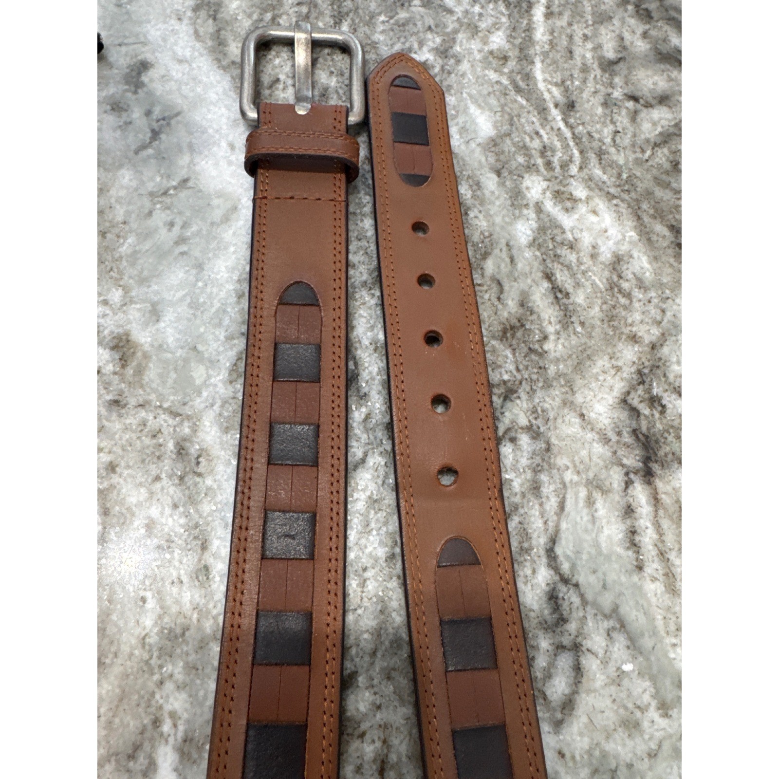 Men&rsquo;s brown leather belt featuring a prominent woven-inlay pattern size 44