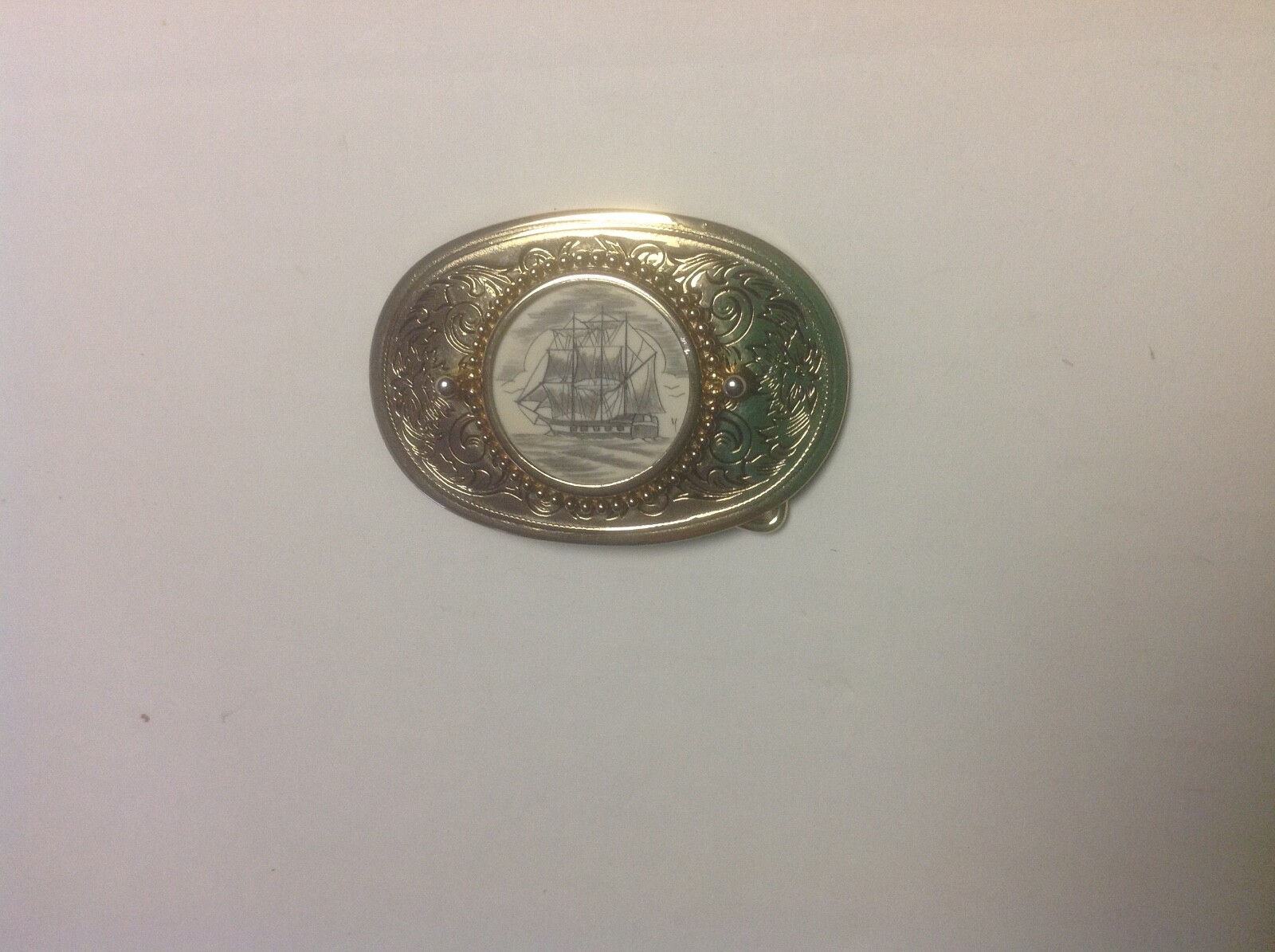 Gold Colored Belt Buckle With Sailing Vessel Artwork